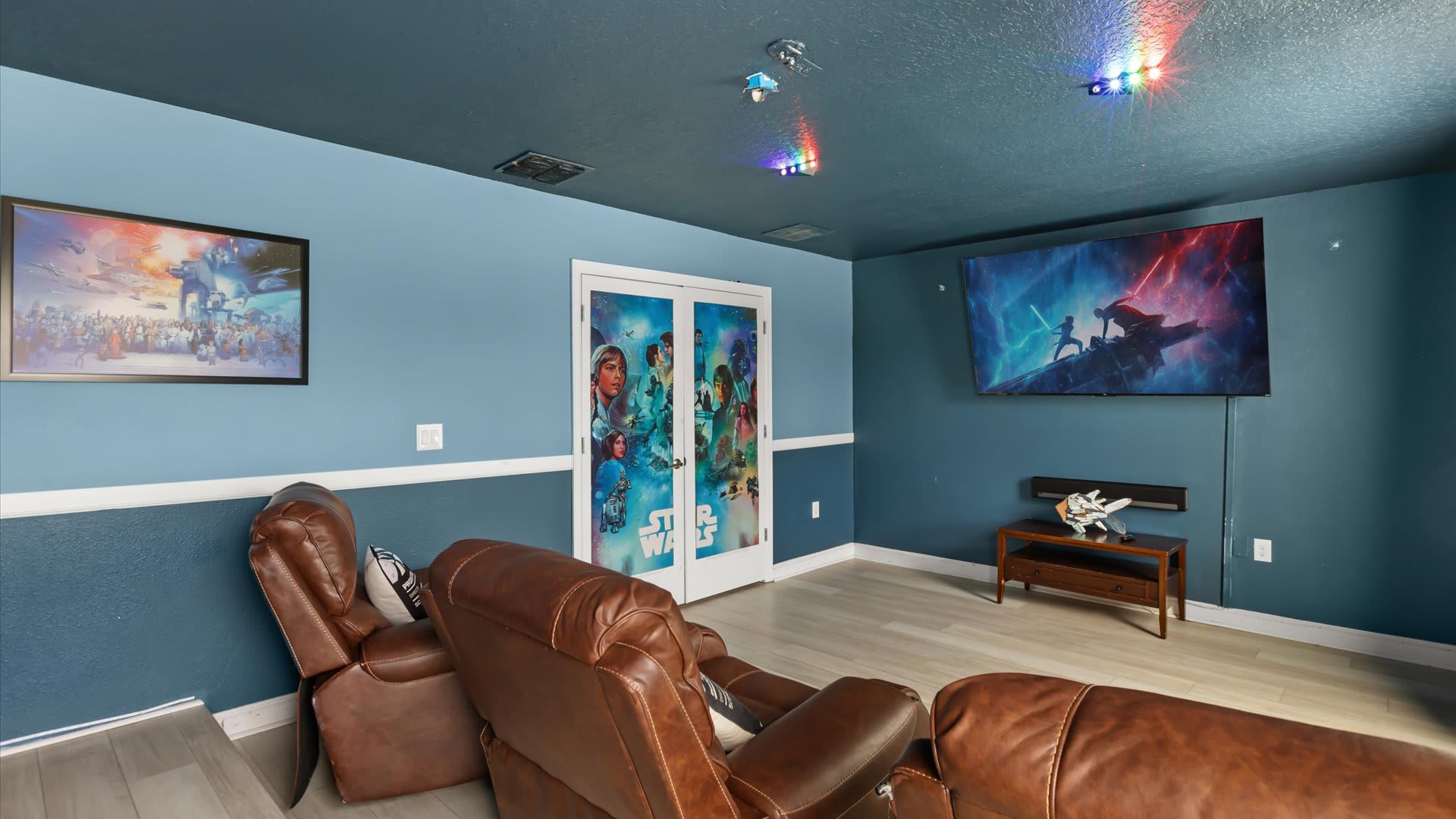 In-home Movie Theater: Transform movie nights into a cinematic experience in this dedicated theater room with plush seating and a big screen.