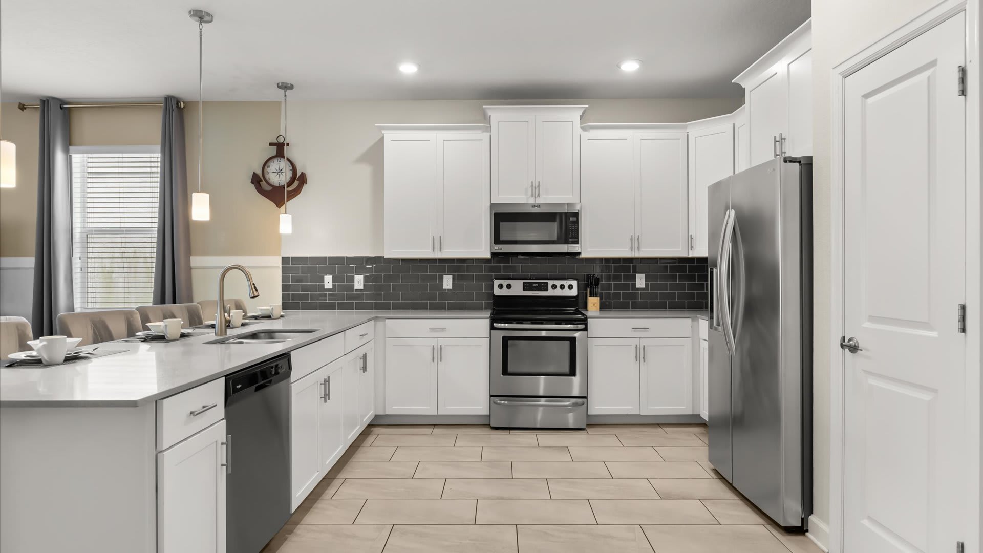 Kitchen: A bright window over the sink brings in natural light as you prepare meals. Complete with modern appliances, a dishwasher, and all essentials, the space is designed for both function and comfort.