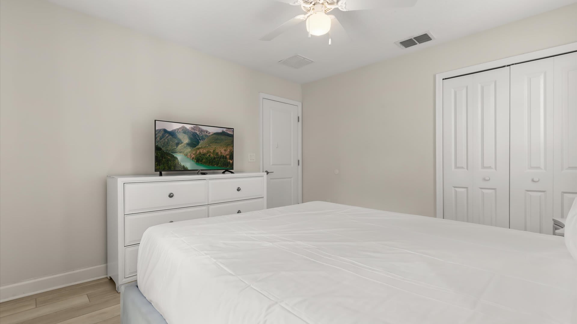 Second Floor, Queen Bed + Shared Bath: A cosy queen bedroom designed for restful nights, conveniently located near a shared bath.