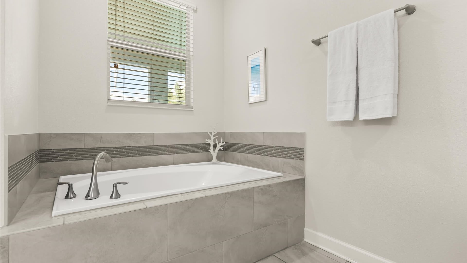 First Floor King Bedroom En-suite: with a double basin, refreshing bathtub and a spacious standing shower