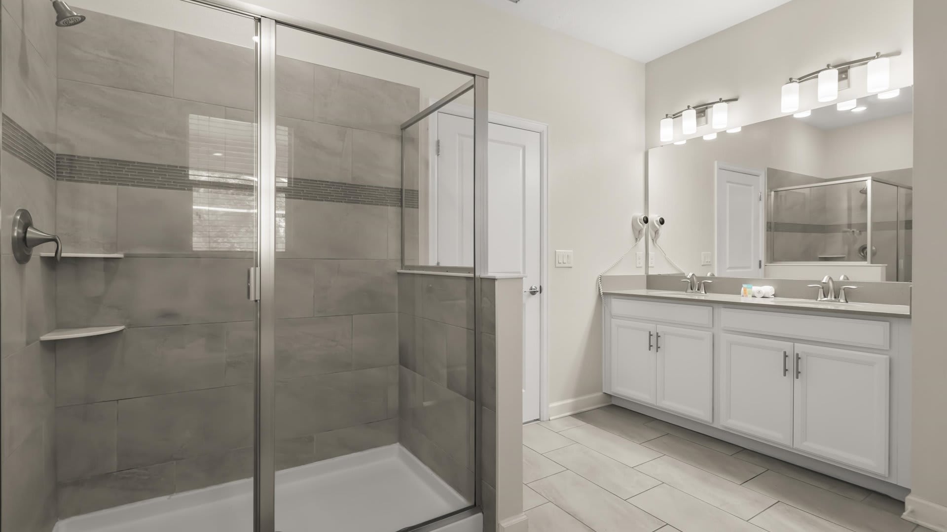 First Floor King Bedroom En-suite: with a double basin, refreshing bathtub and a spacious standing shower