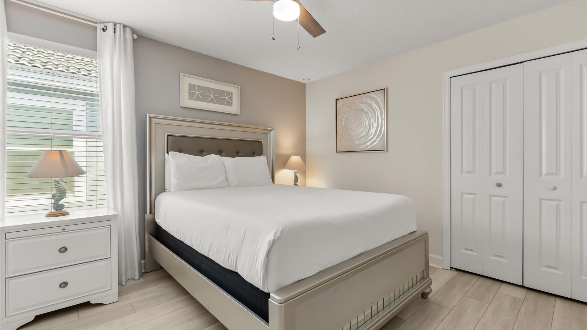 Second Floor, Queen Bed + Shared Bath: Stylish and serene, this queen bedroom provides a restful stay with shared bath access.