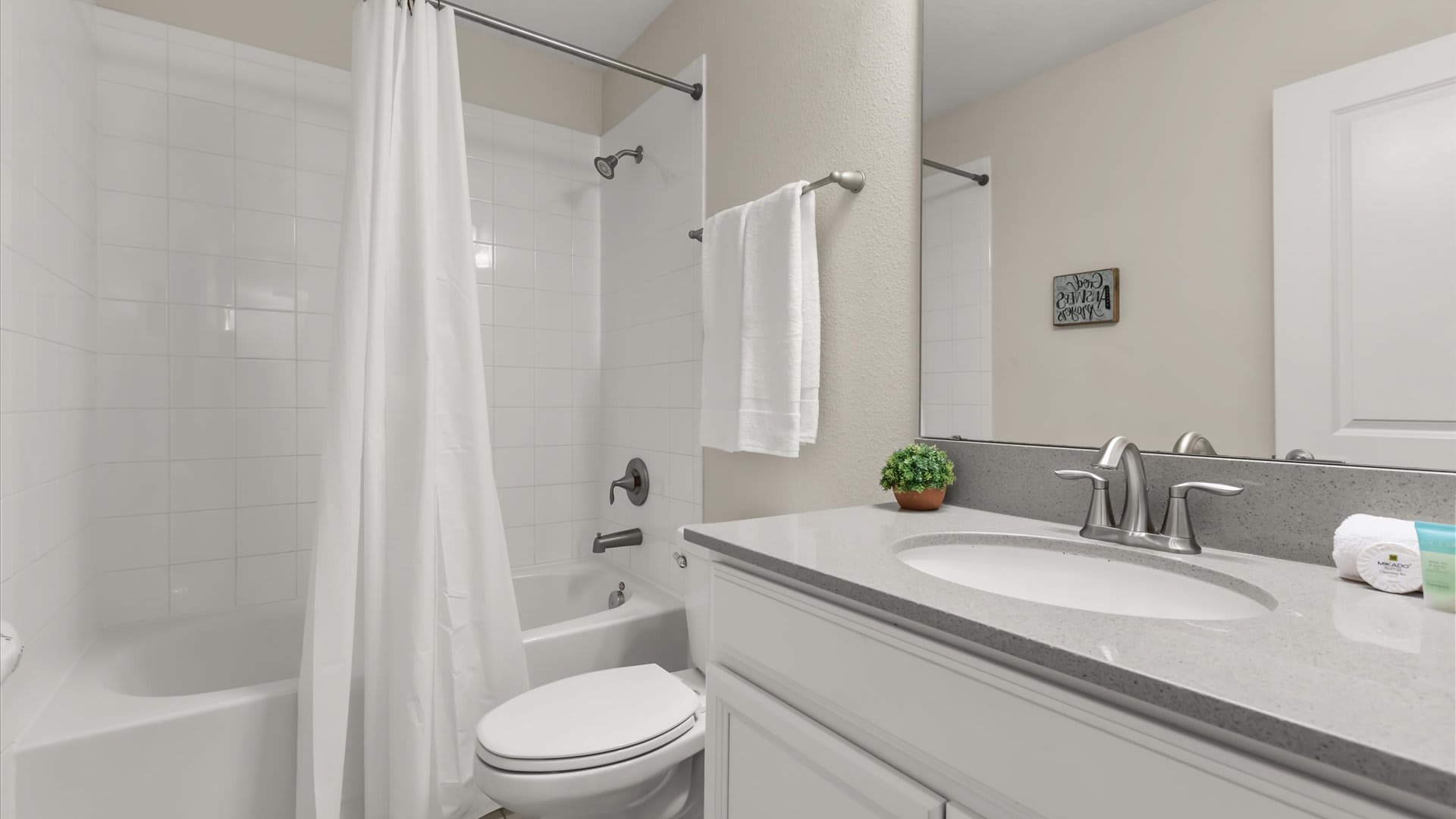 Full Bathroom with combined bathtub and shower