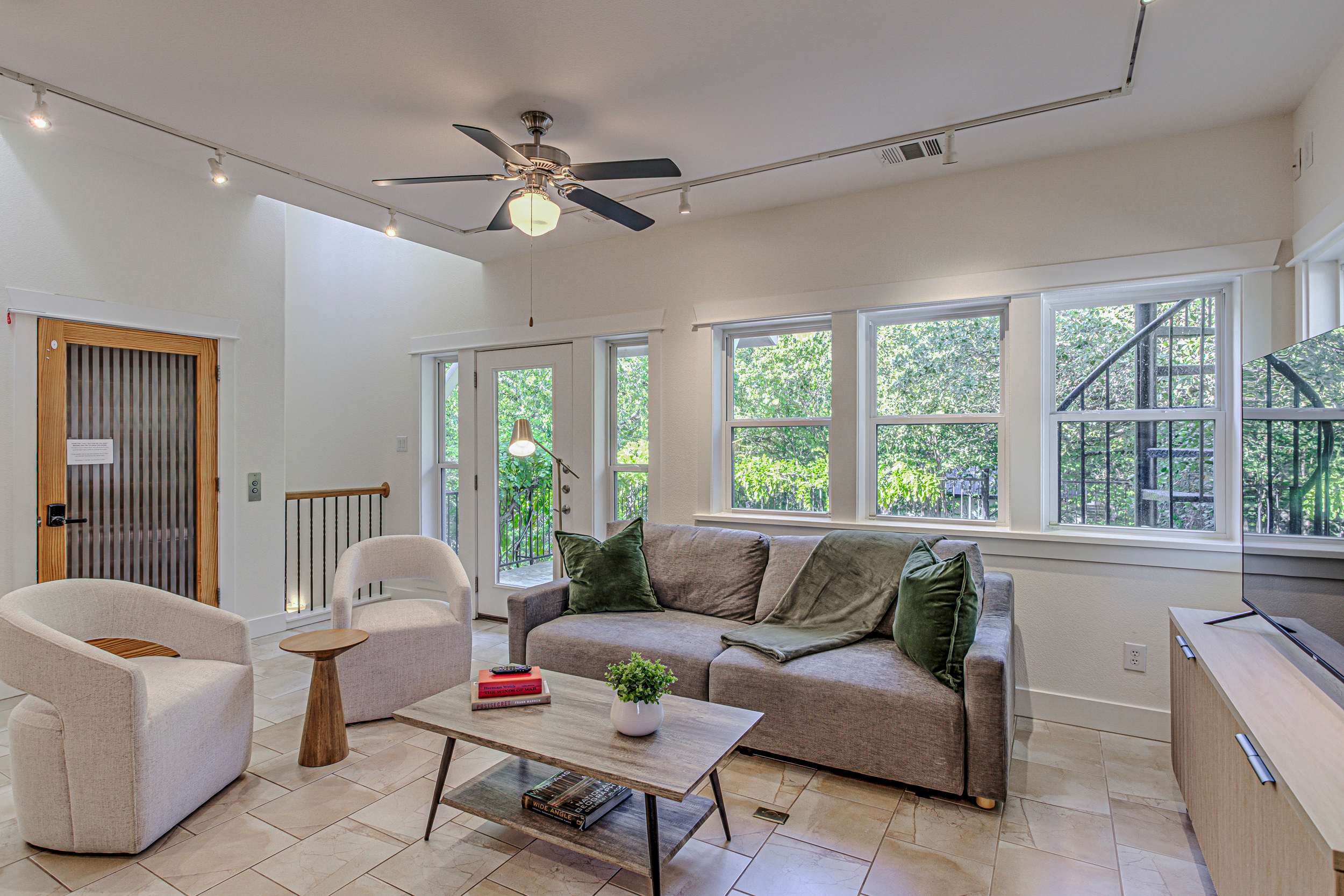 Sunlit, open concept living/kitchen space.