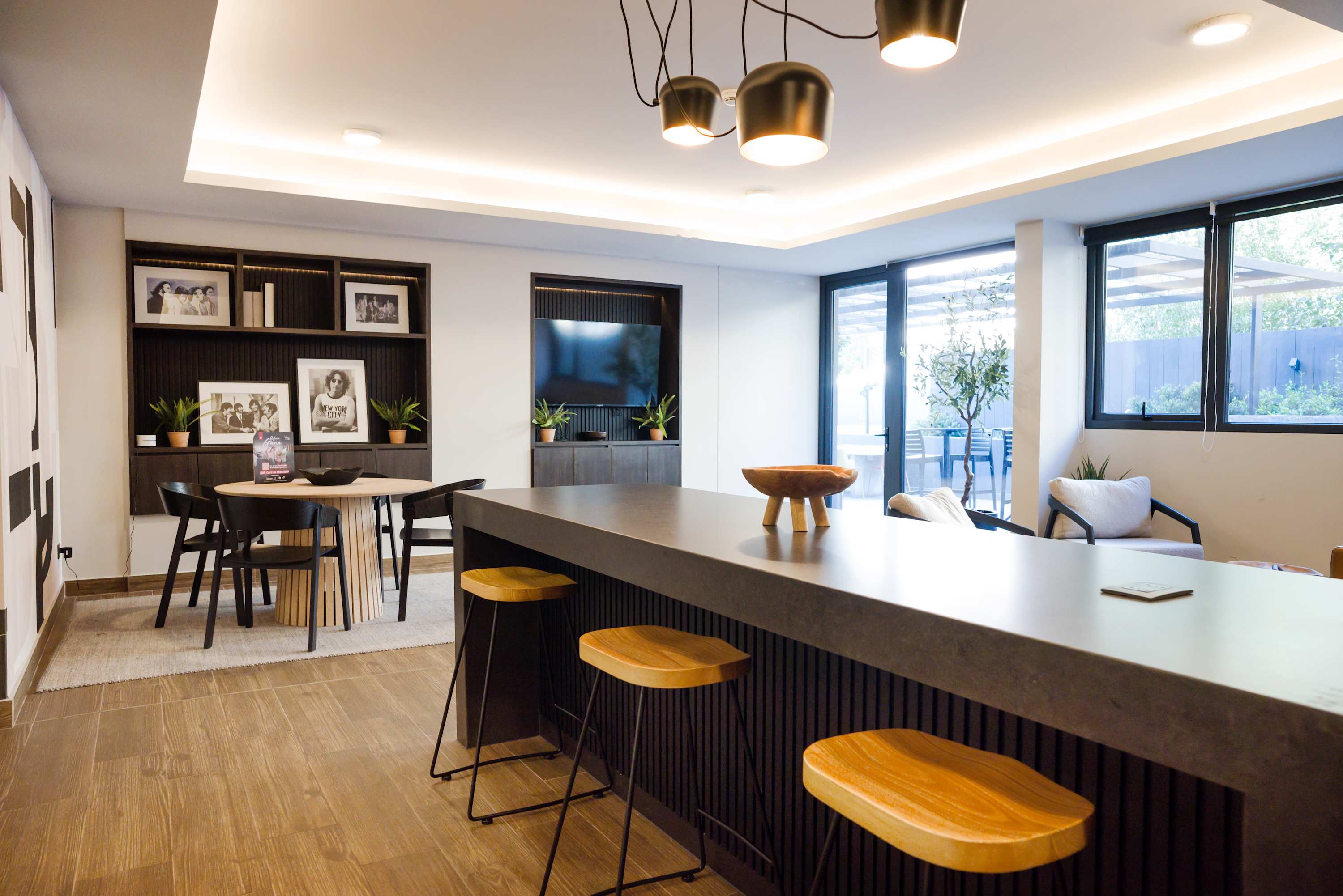 Modern lounge with stylish seating and natural light, perfect for relaxation. 