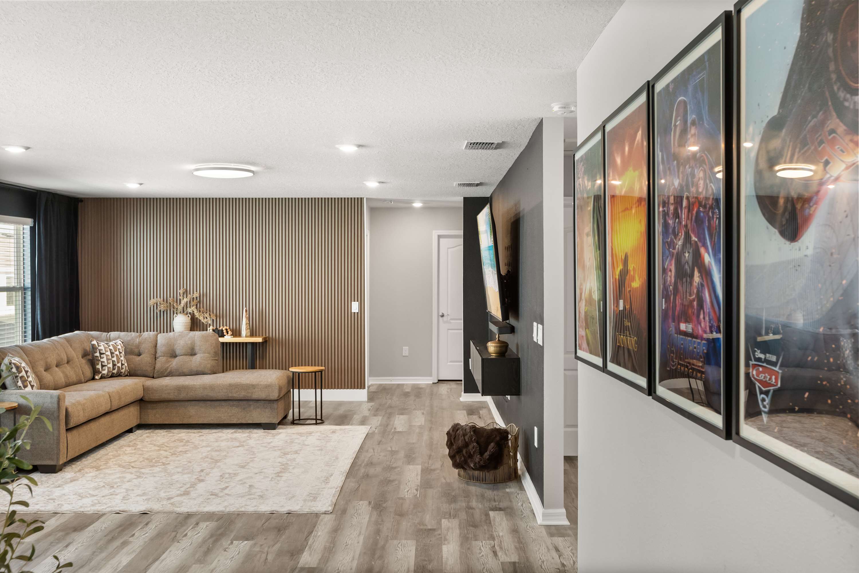 Upstairs TV Lounge / Loft - Cozy upstairs lounge with a big-screen TV and queen sleeper sofa—great for movies, games, or extra sleeping space.