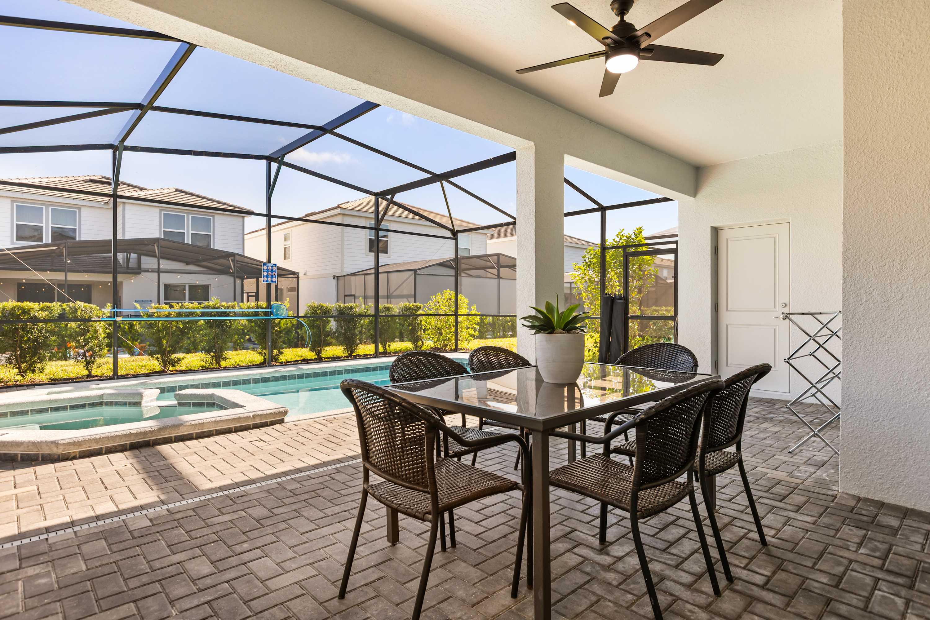 Patio - Covered patio and comfortable seating that overlooks the pool—perfect for morning coffee, evening drinks, or watching the kids swim.