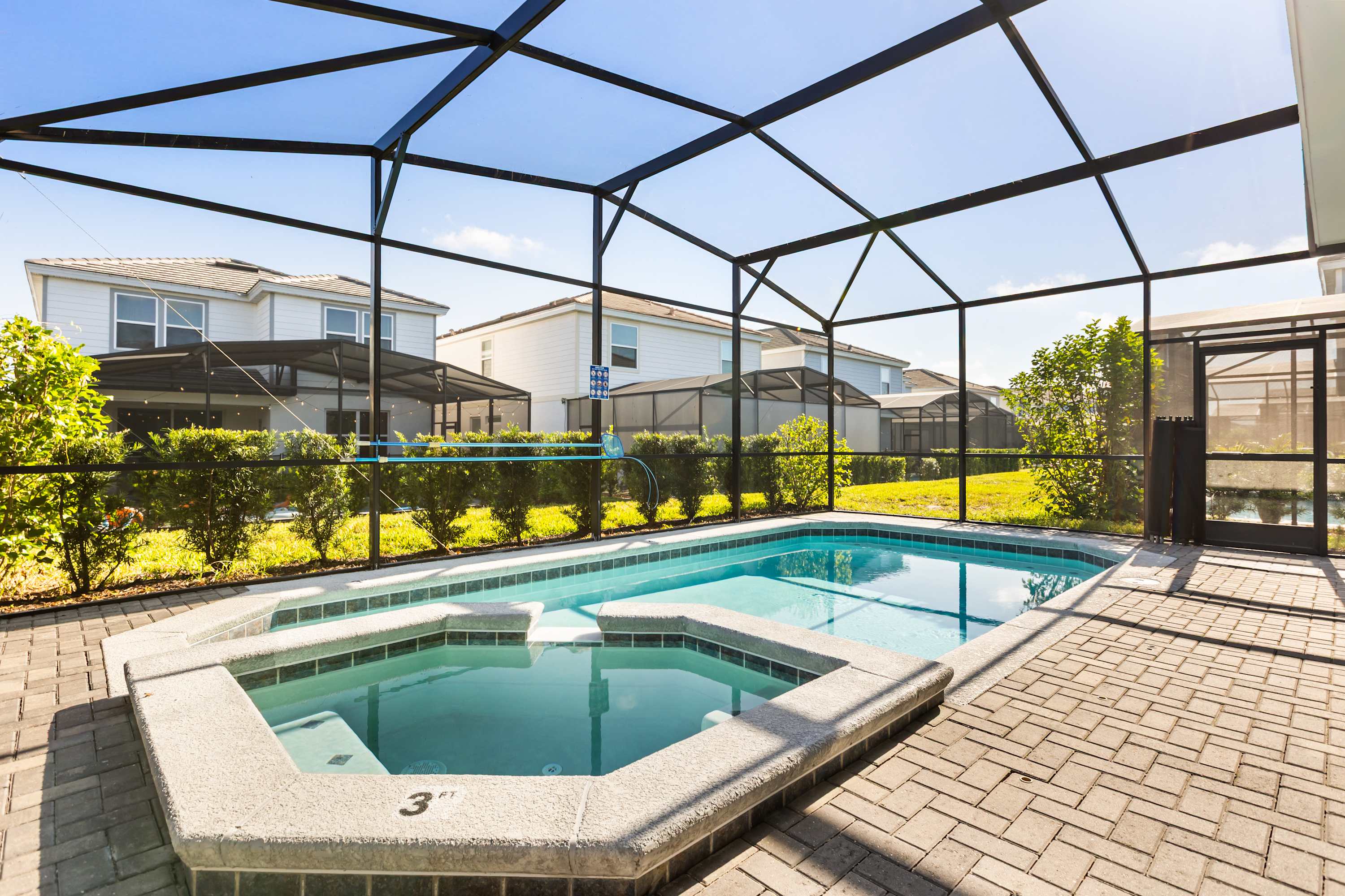 Outdoor Pool - Soak up the sun by your private screened-in pool, complete with lounge chairs and plenty of space for family fun or quiet relaxation.