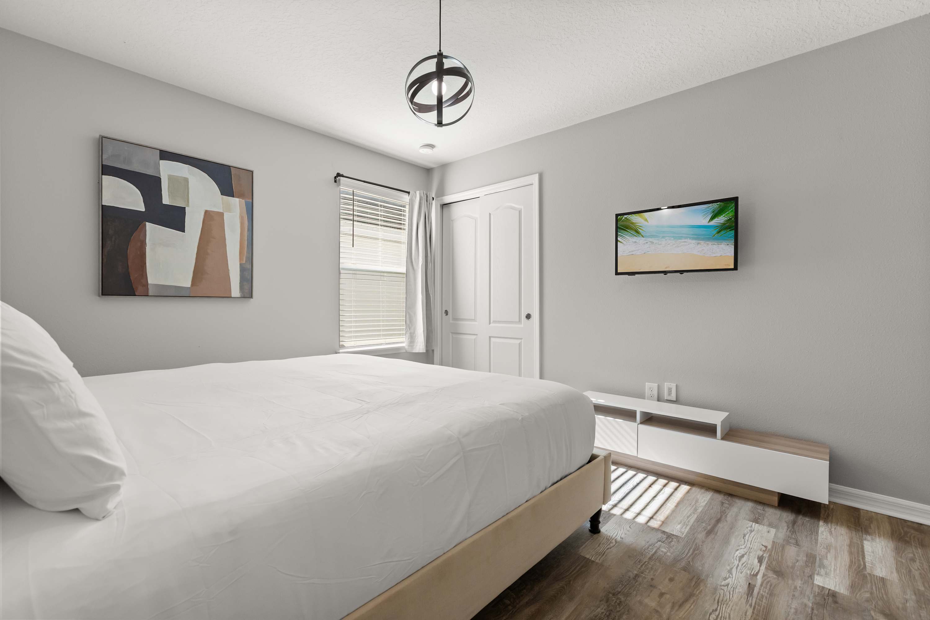 Bedroom 4 – Tranquil king bedroom featuring plush bedding and a calm, welcoming atmosphere.