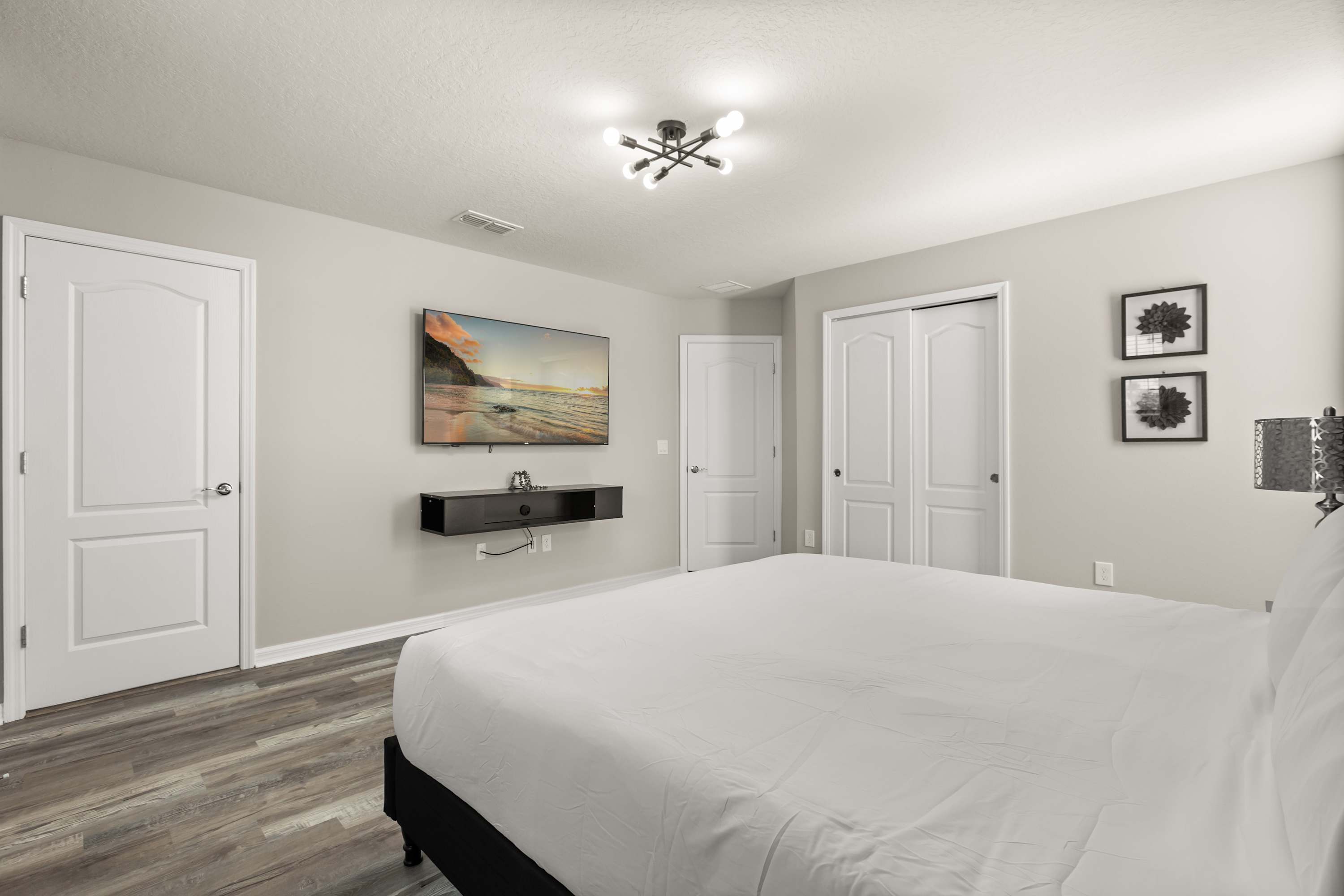 Bedroom 4 – Tranquil king bedroom featuring plush bedding and a calm, welcoming atmosphere.