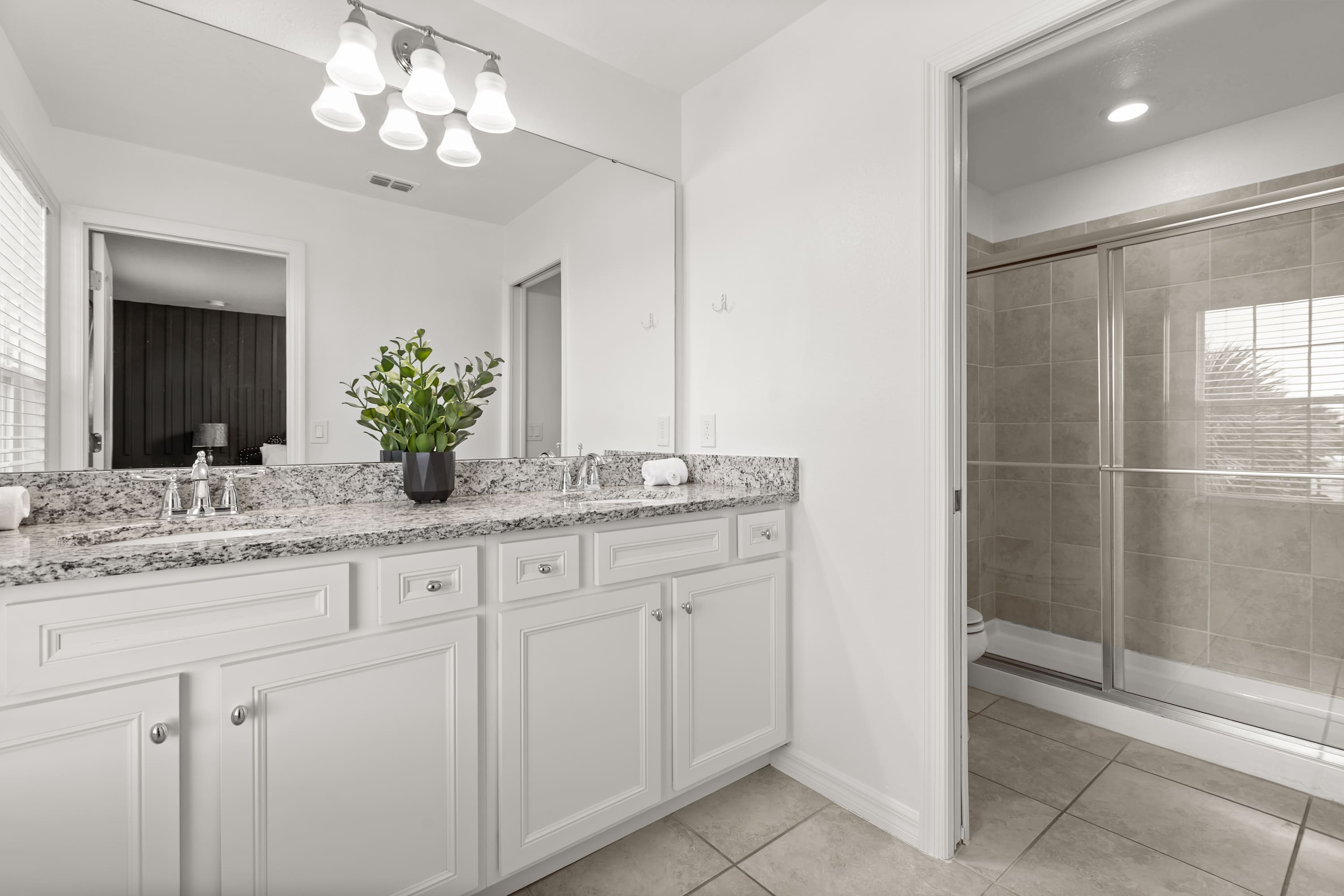Full bathroom with double basin and spacious standing shower