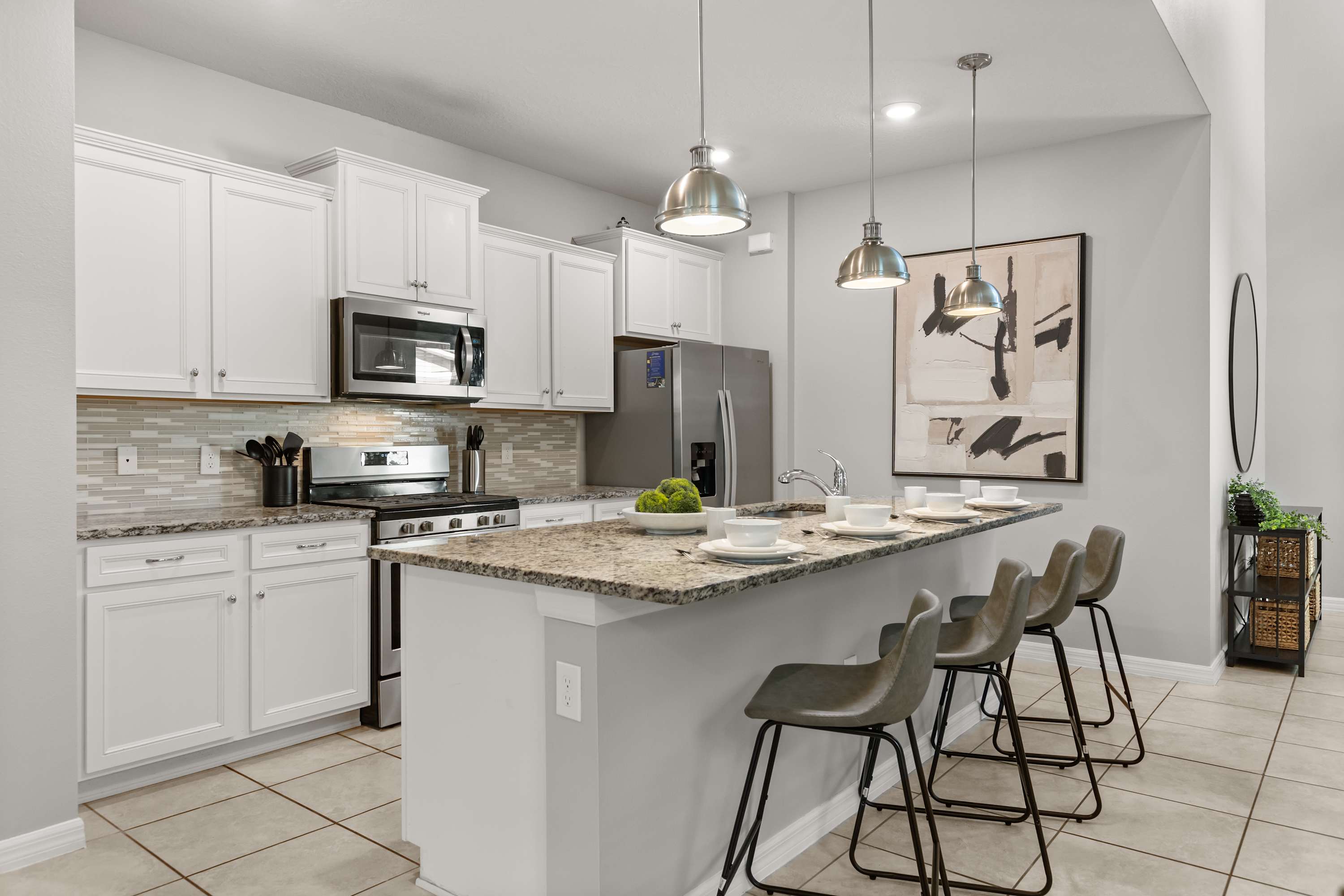 Kitchen - Fully stocked kitchen features modern appliances, generous counter space, and all the essentials for cooking at home.