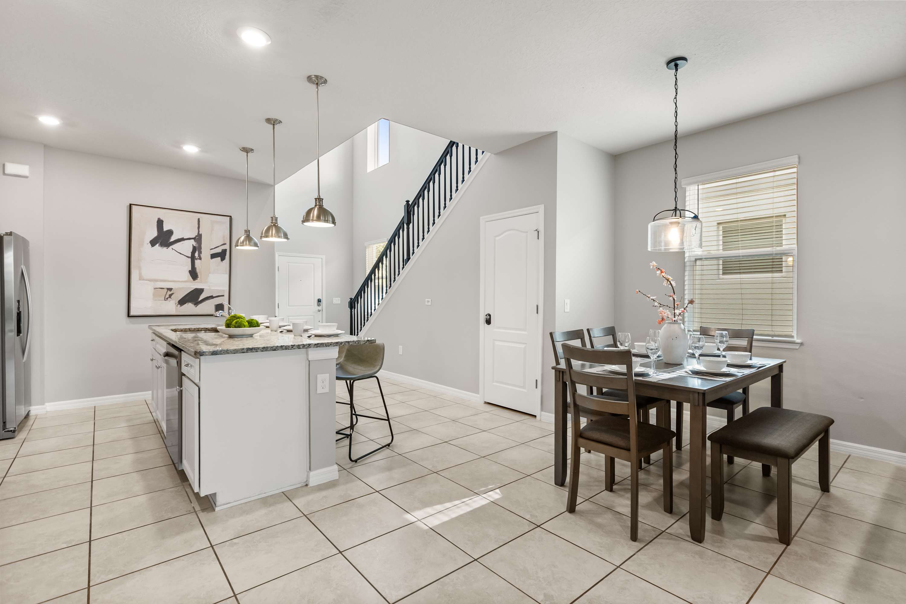 Kitchen - Fully stocked kitchen features modern appliances, a dining area, generous counter space, and all the essentials for cooking at home.
