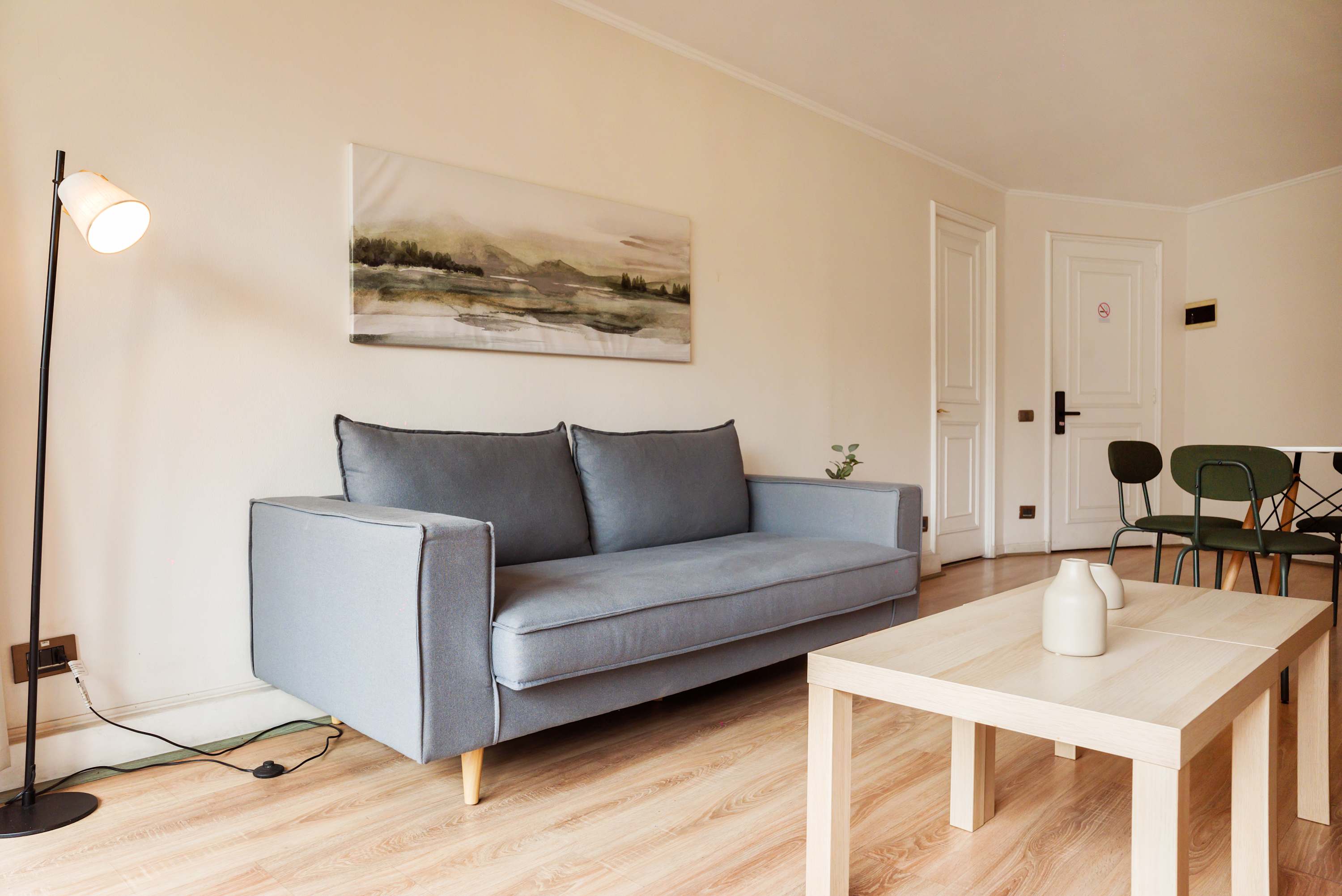 Relax in this cozy living room featuring a stylish sofa and modern decor, perfect for unwinding after a day of exploring.