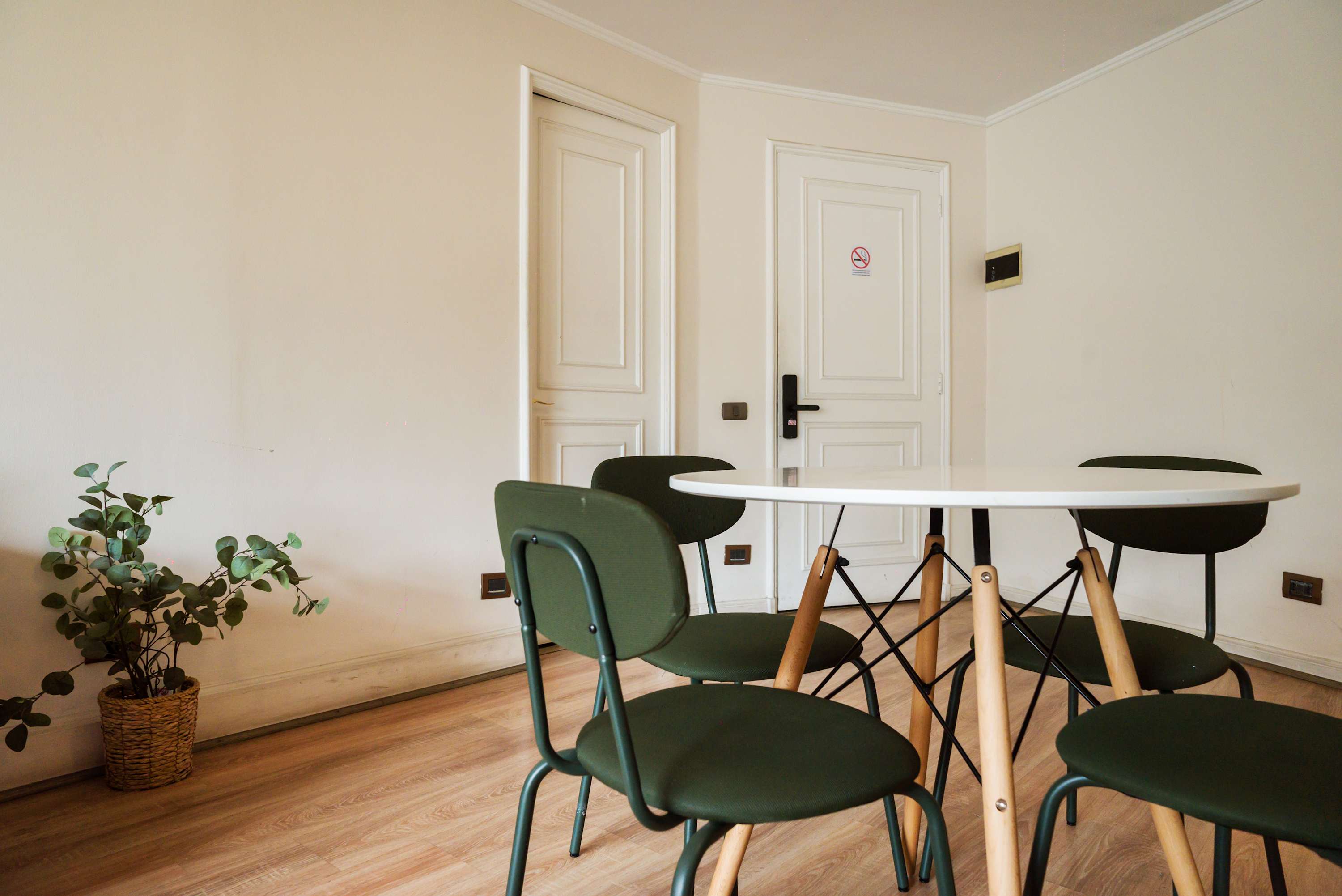 Cozy dining area with modern furnishings, perfect for intimate meals or work sessions.