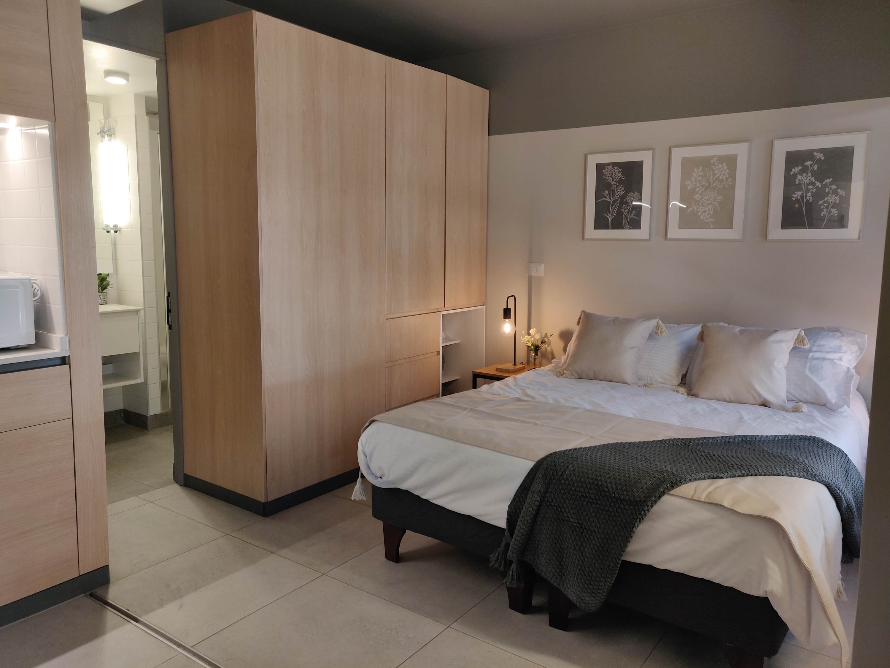 Relax in this cozy studio with a comfortable bed and stylish decor, perfect for a restful stay in Chile.