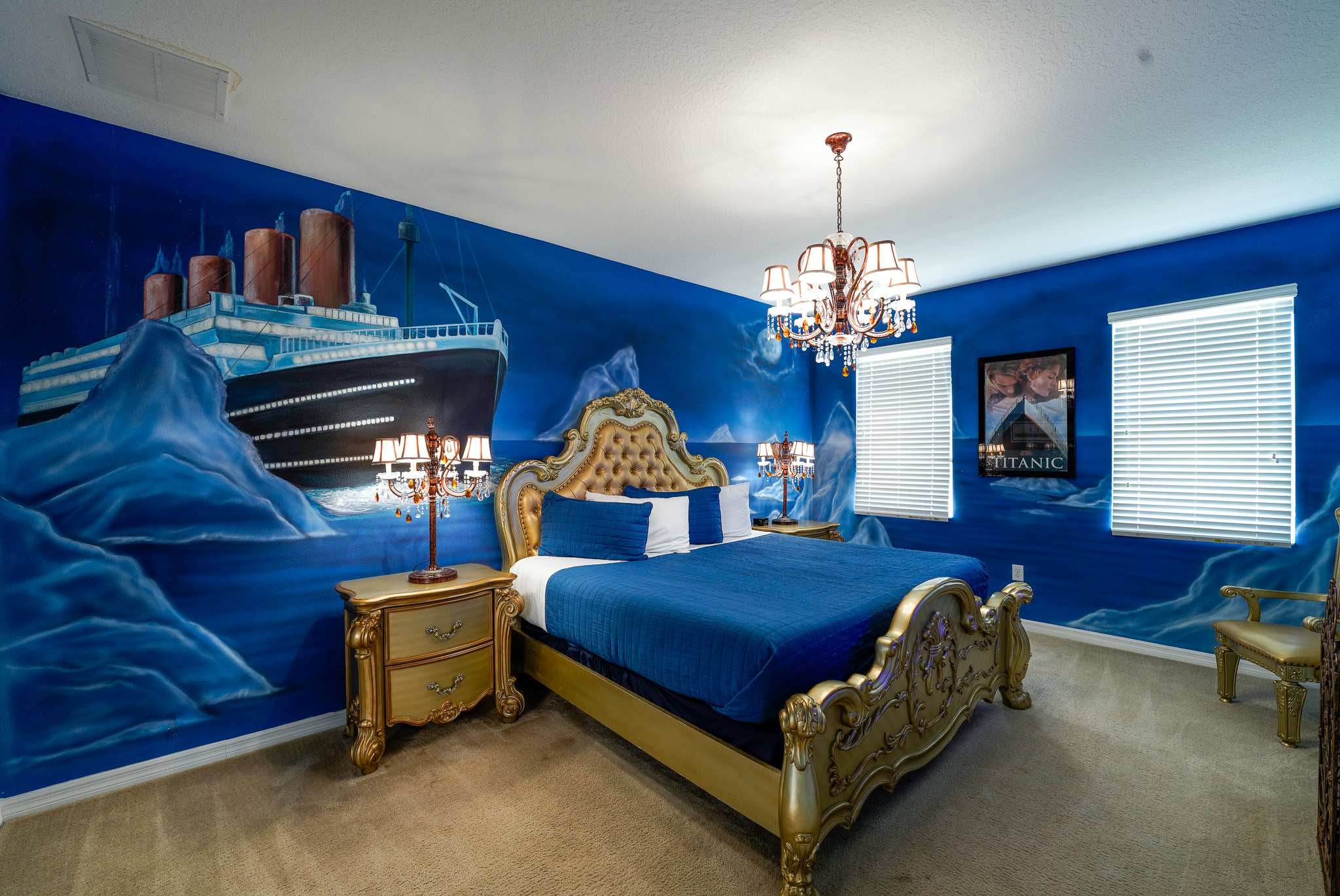 Immerse yourself in this Titanic-themed bedroom with luxurious decor and a stunning mural. Perfect for a unique stay experience.