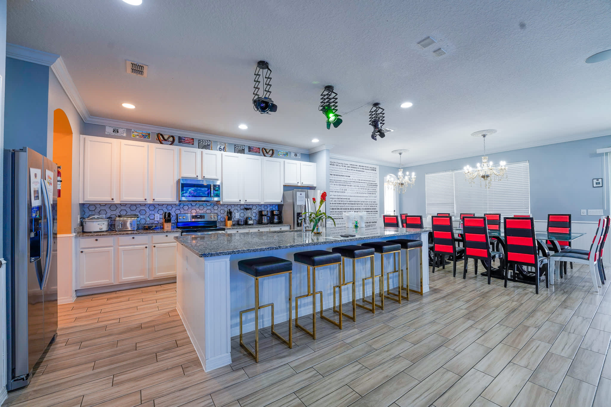 Experience culinary delight in this expansive kitchen with a stylish dining area, perfect for large gatherings.