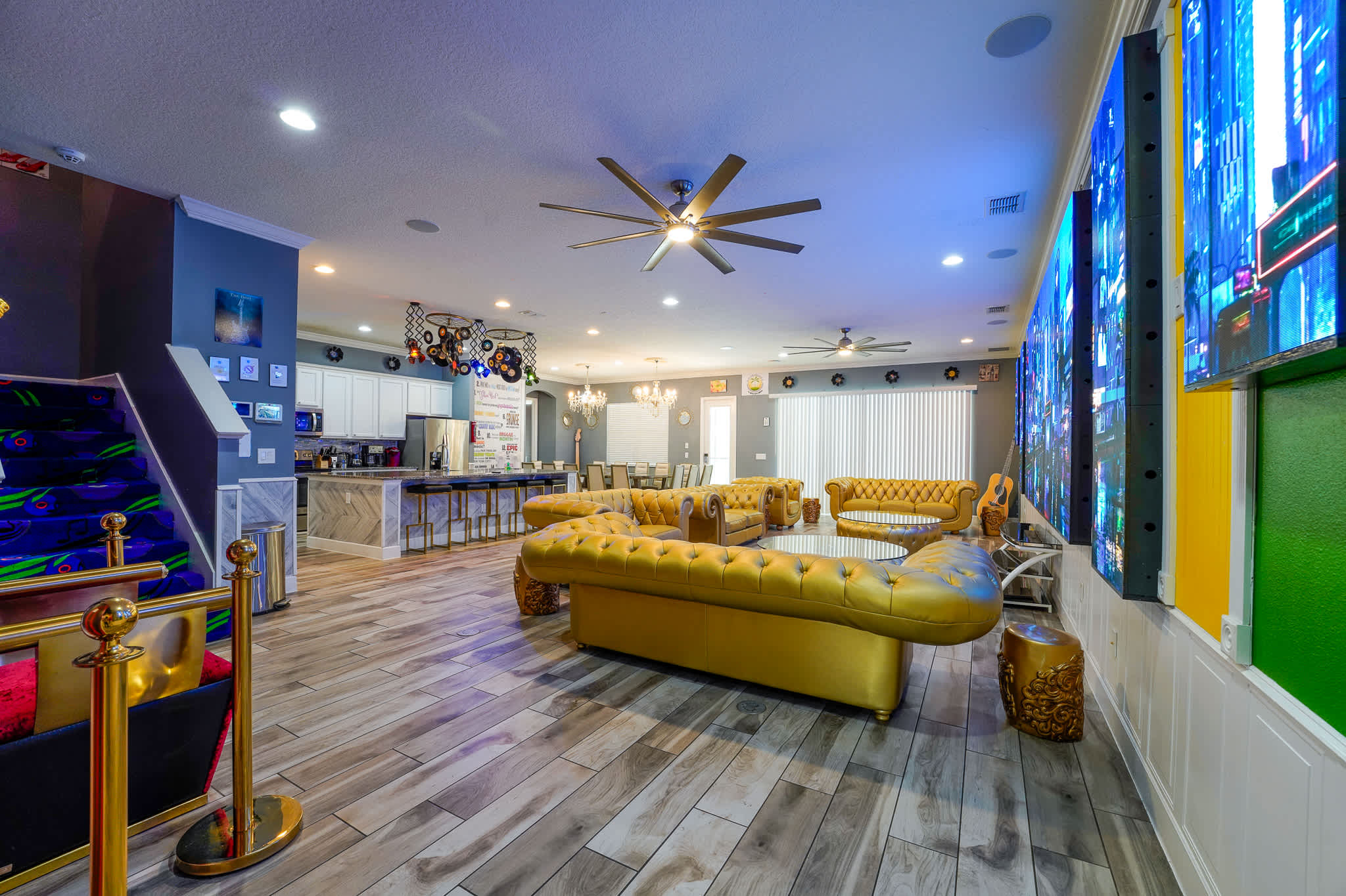 Luxurious entertainment space with vibrant seating, modern amenities, and a chic bar area, perfect for gatherings and relaxation.