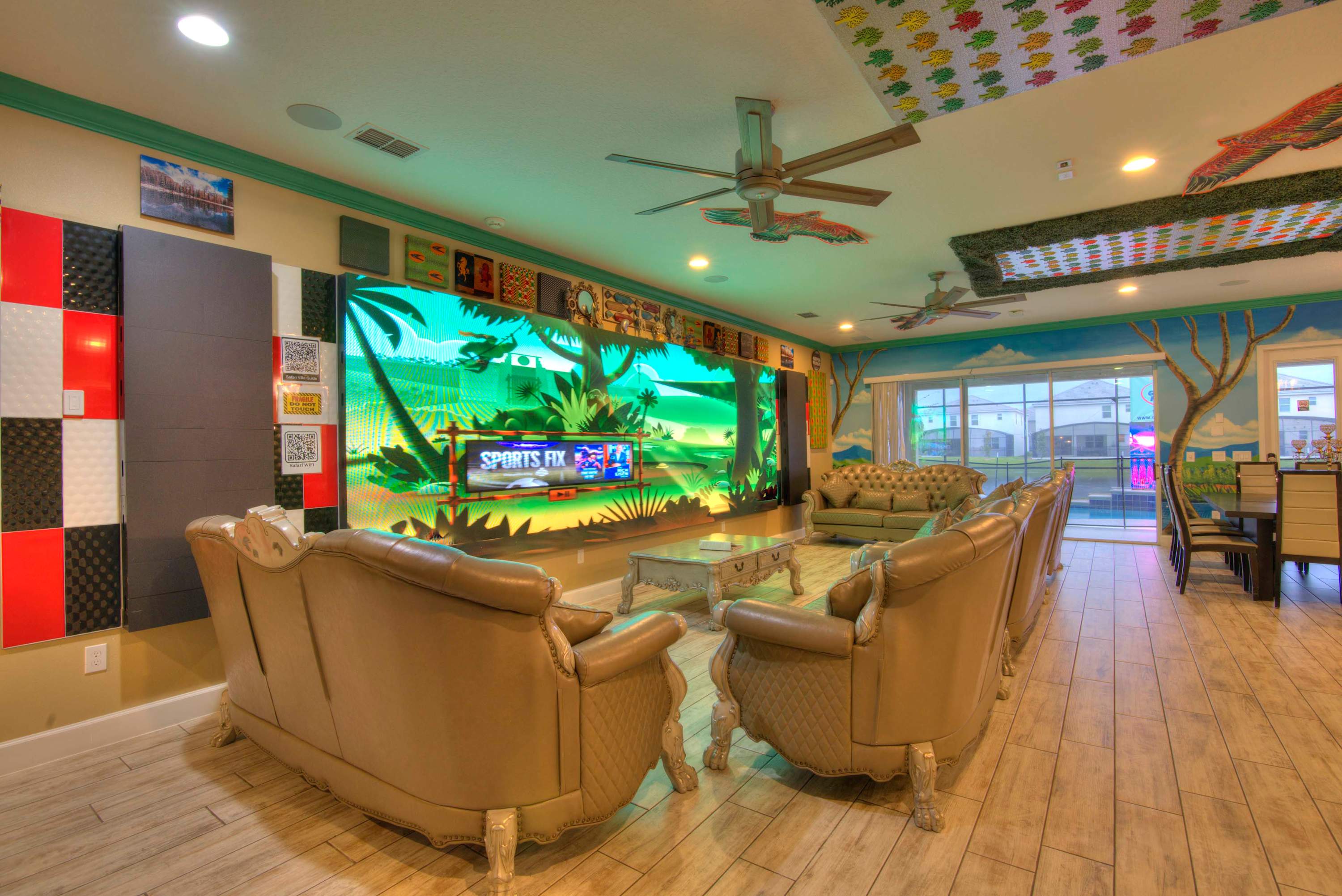 Enjoy vibrant entertainment in this spacious living room with plush seating and a stunning TV setup, perfect for gatherings.