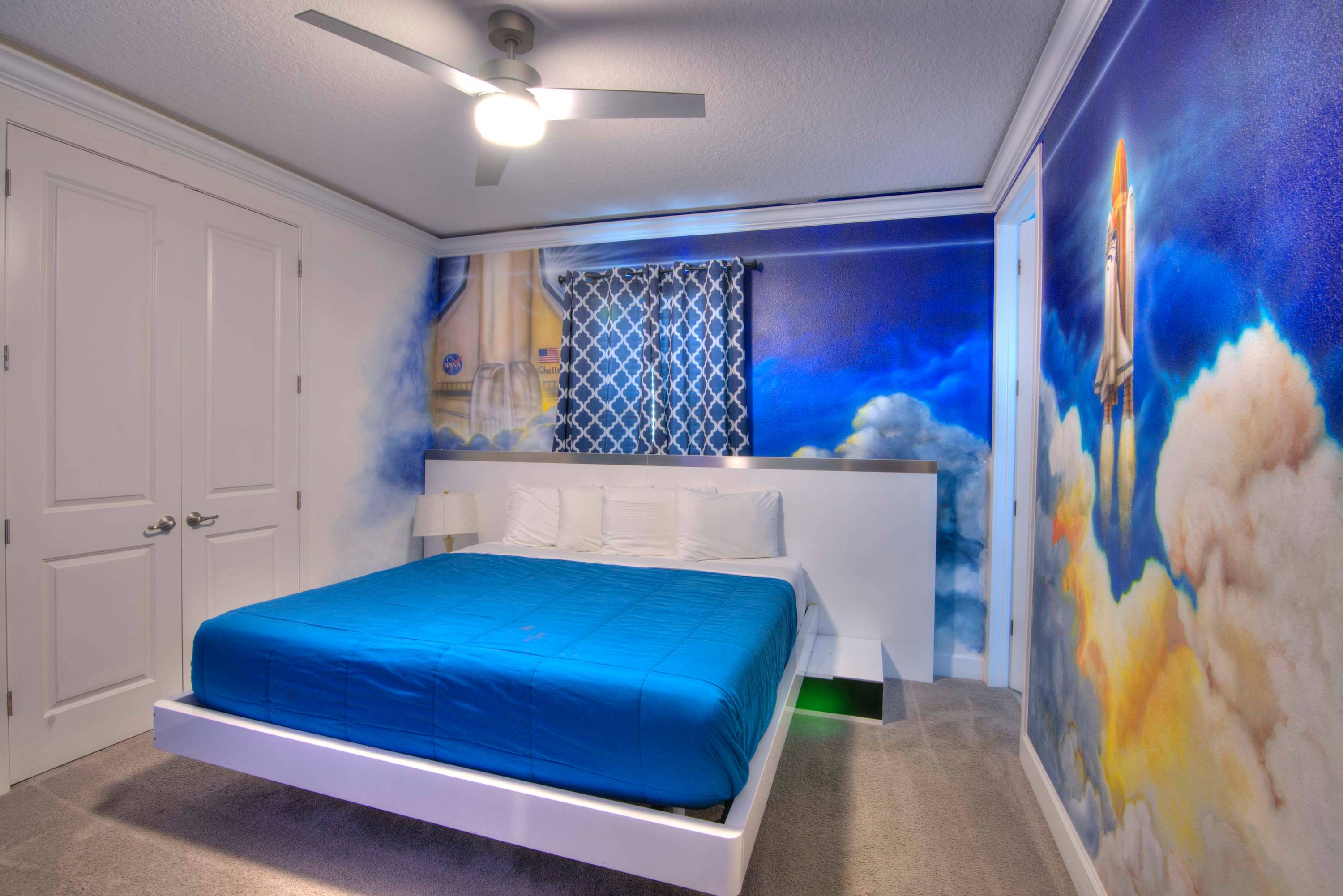 Experience a cosmic adventure in this space-themed bedroom, perfect for dreamers and explorers.