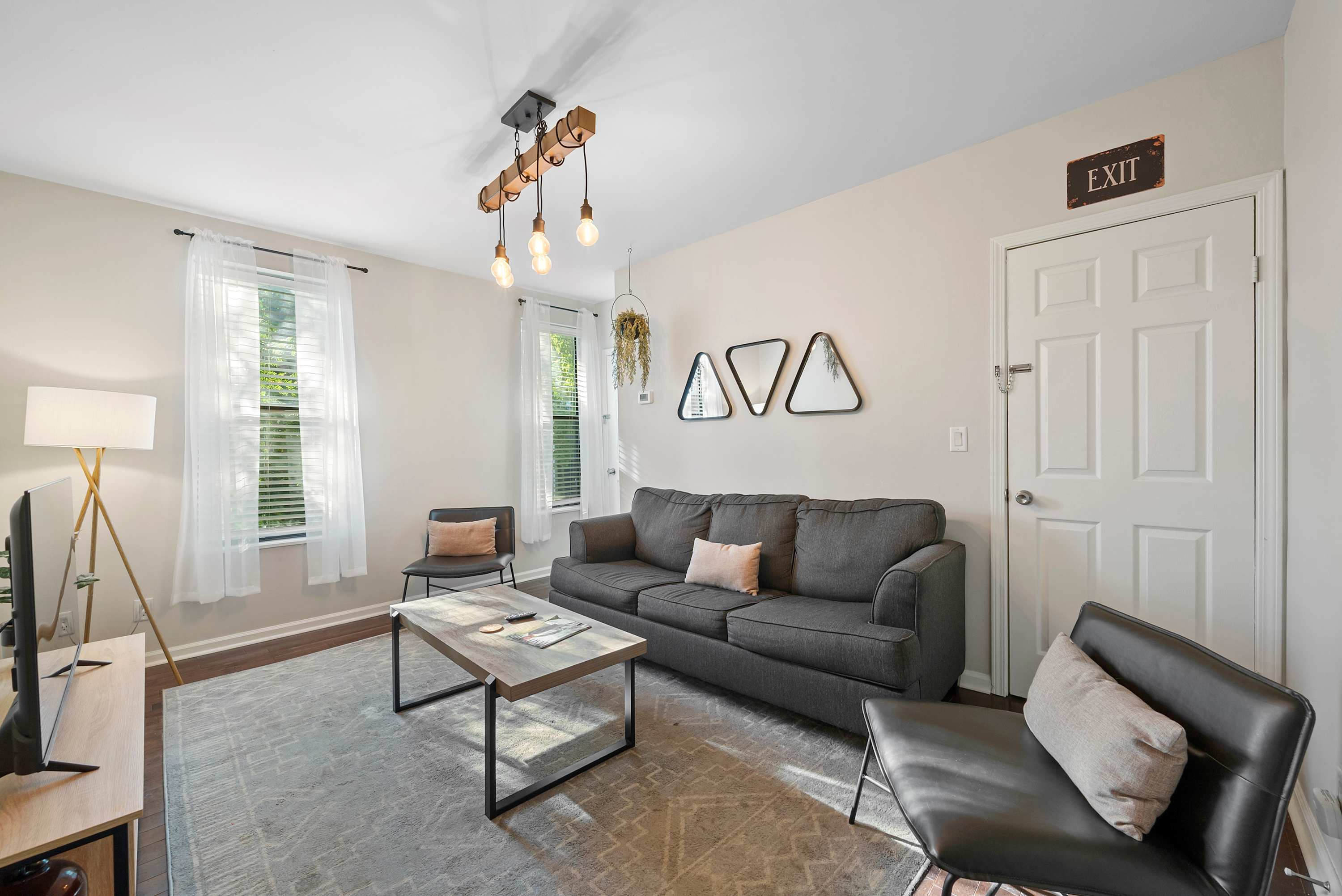 Unwind & stream your favorites on the smart TV in #870.5’s chic living room​