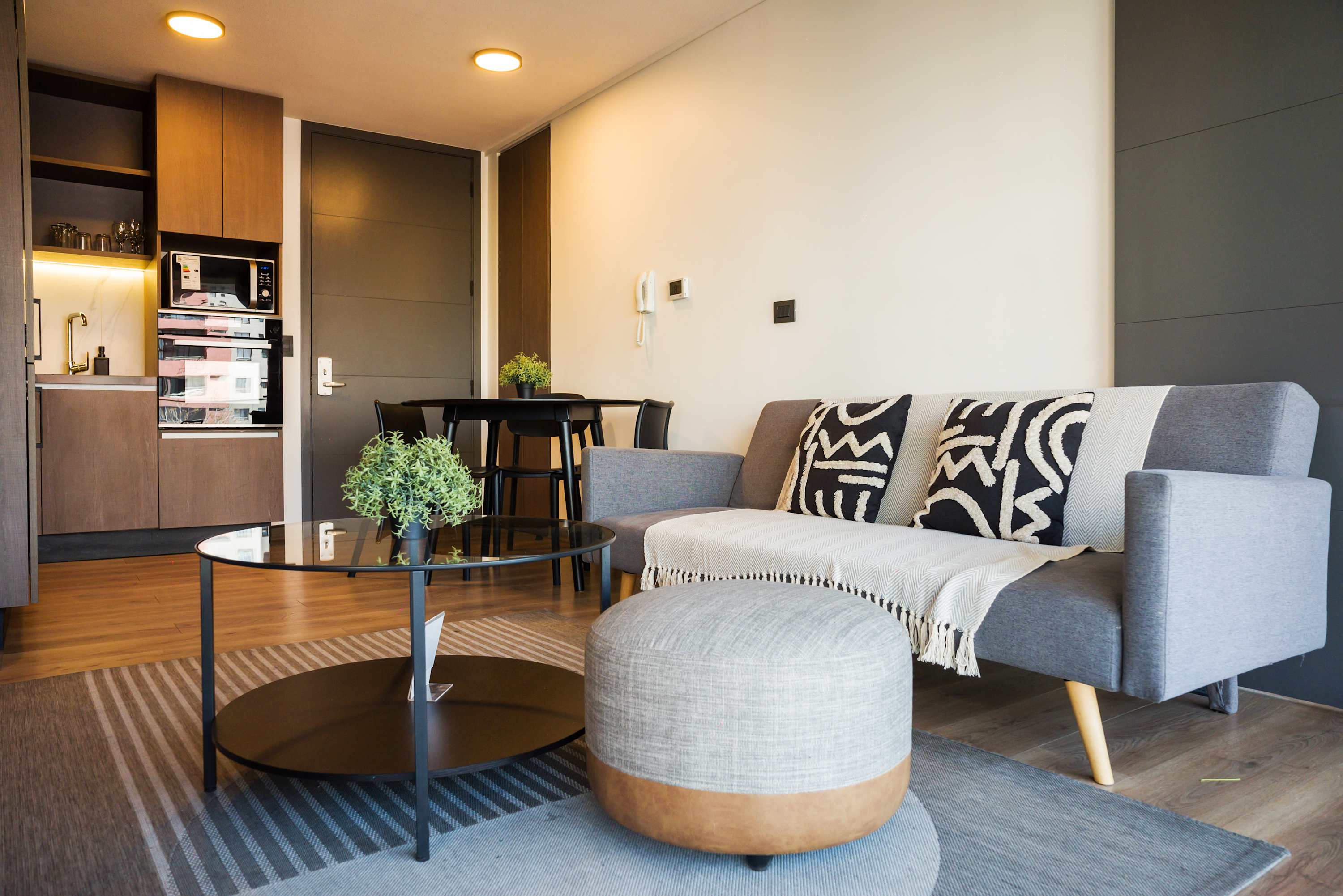 Cozy and stylish living area with modern amenities, perfect for relaxing after a day exploring the city.