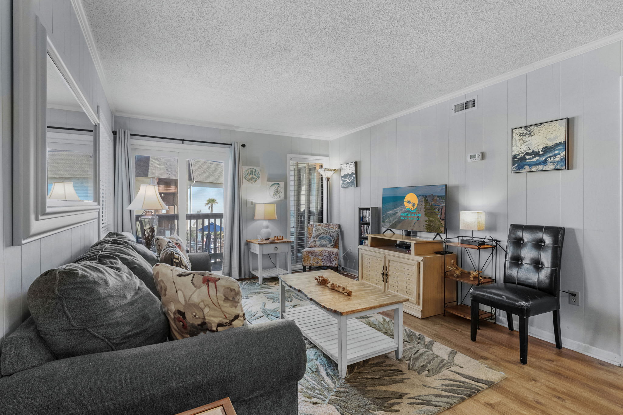 Living room with modern decor and natural light.