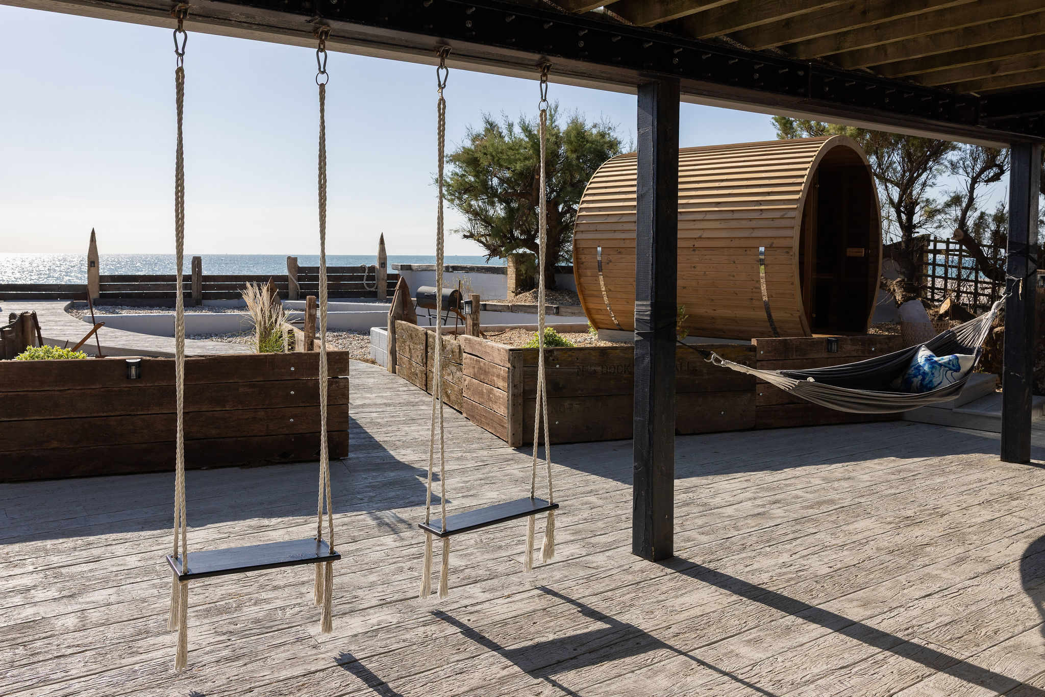 Gently swing as you watch the waves lap the shore, with the sea breeze in your hair...bliss.