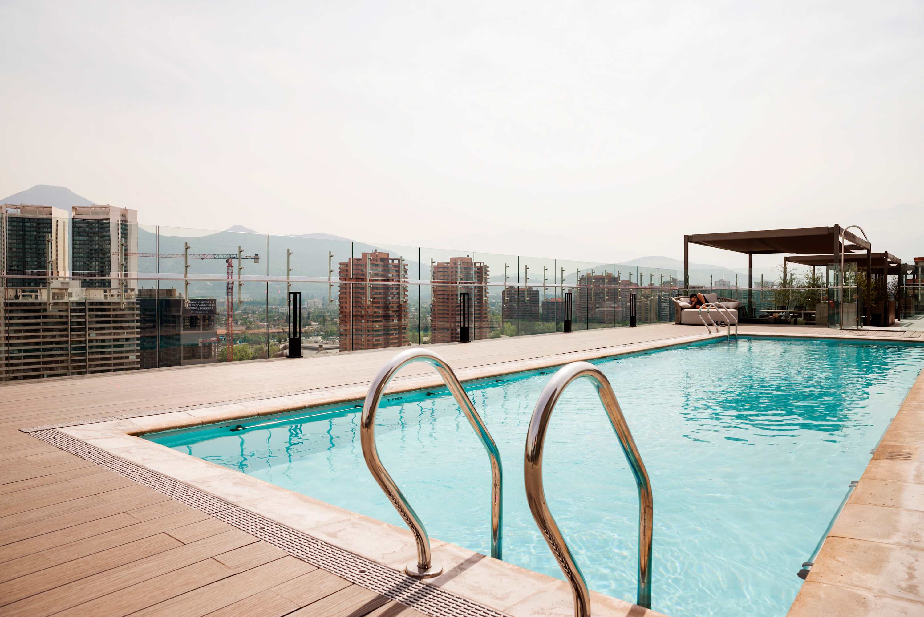 Enjoy stunning city and mountain views from the rooftop pool, perfect for relaxation and leisure.
