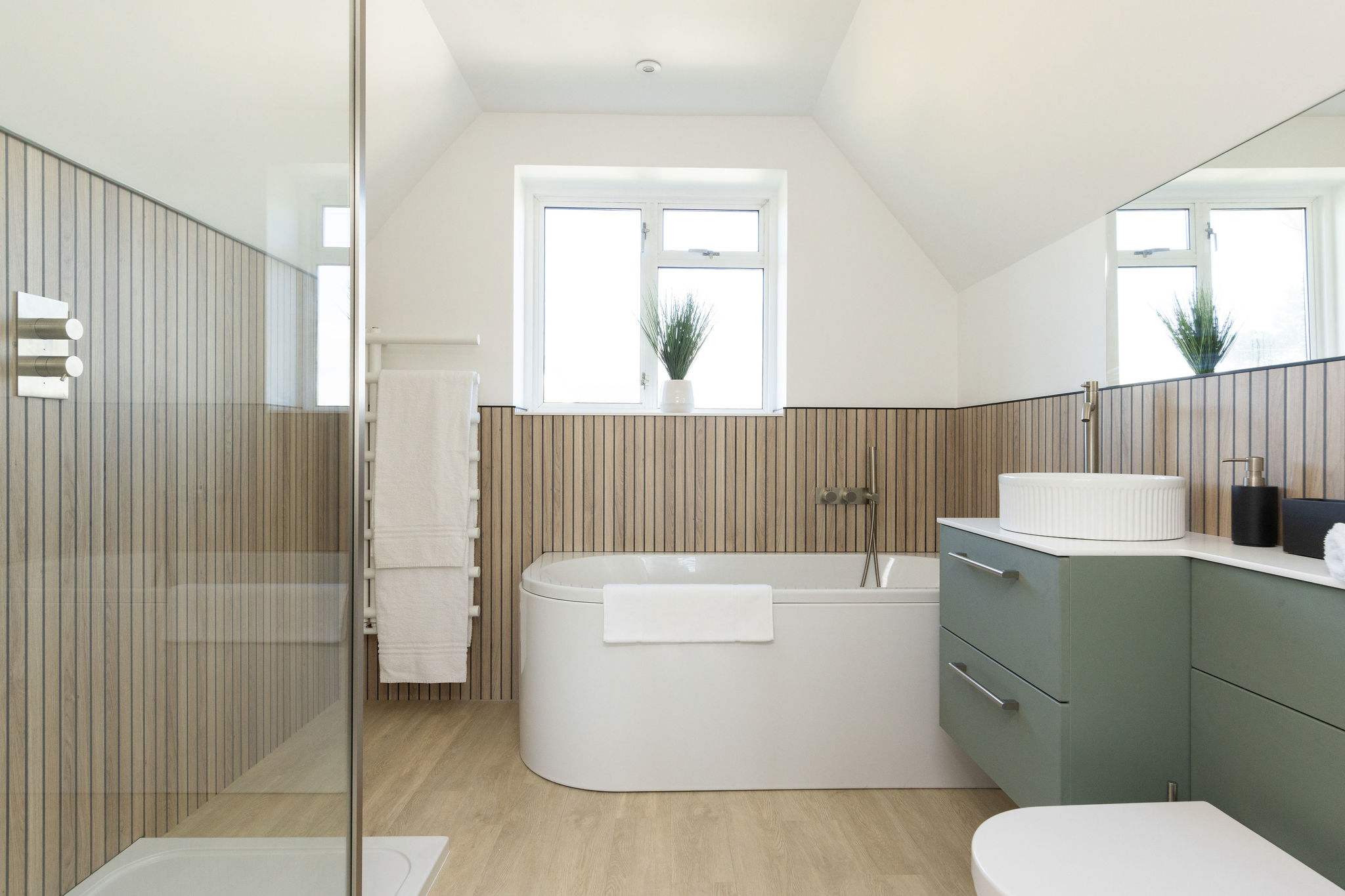 The main ensuite is hotel standard, with huge bath, walk-in shower and bespoke vanity unit.