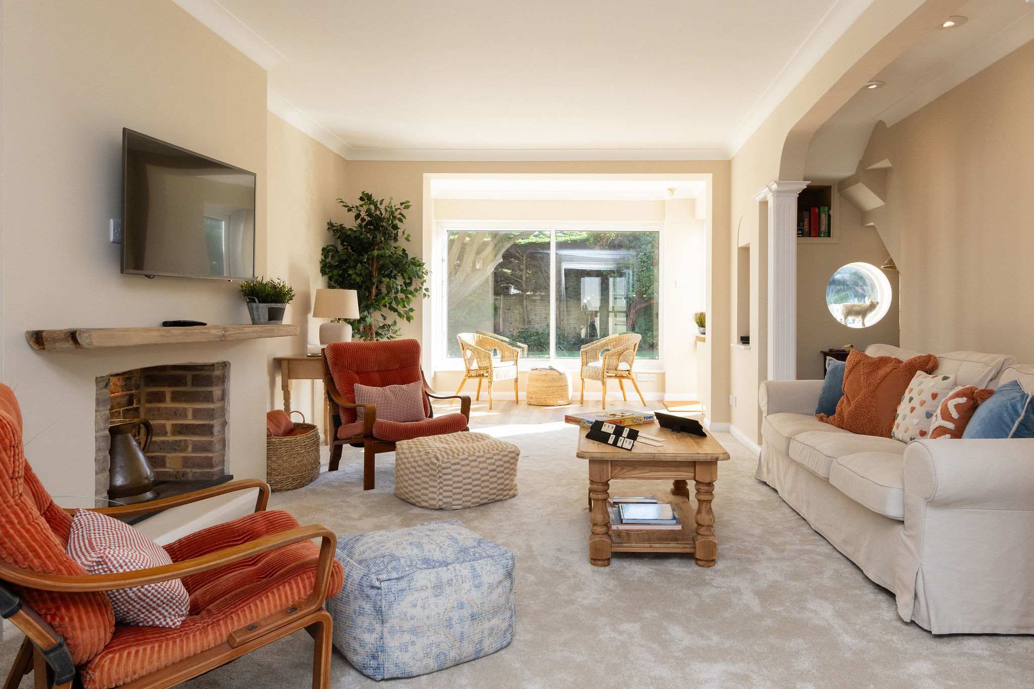 The lounge has ample seating including a 3 seater sofa and chairs.