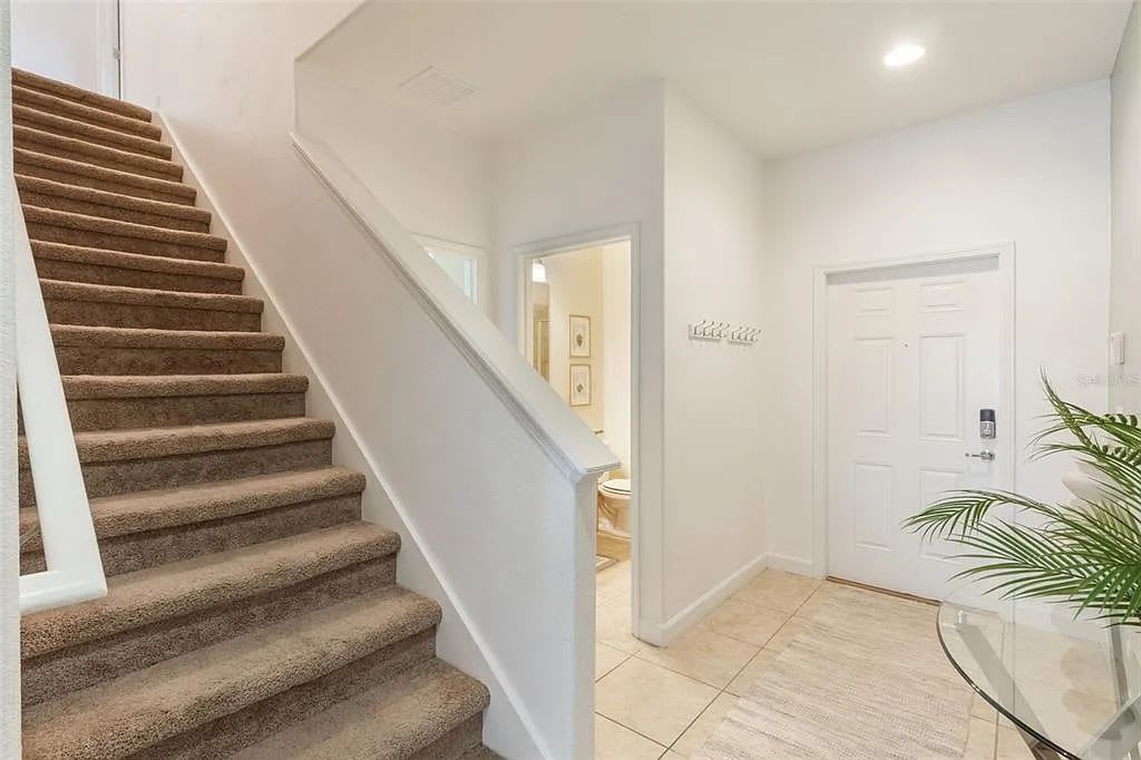 Staircase inside the home leading to the upstairs bedrooms.