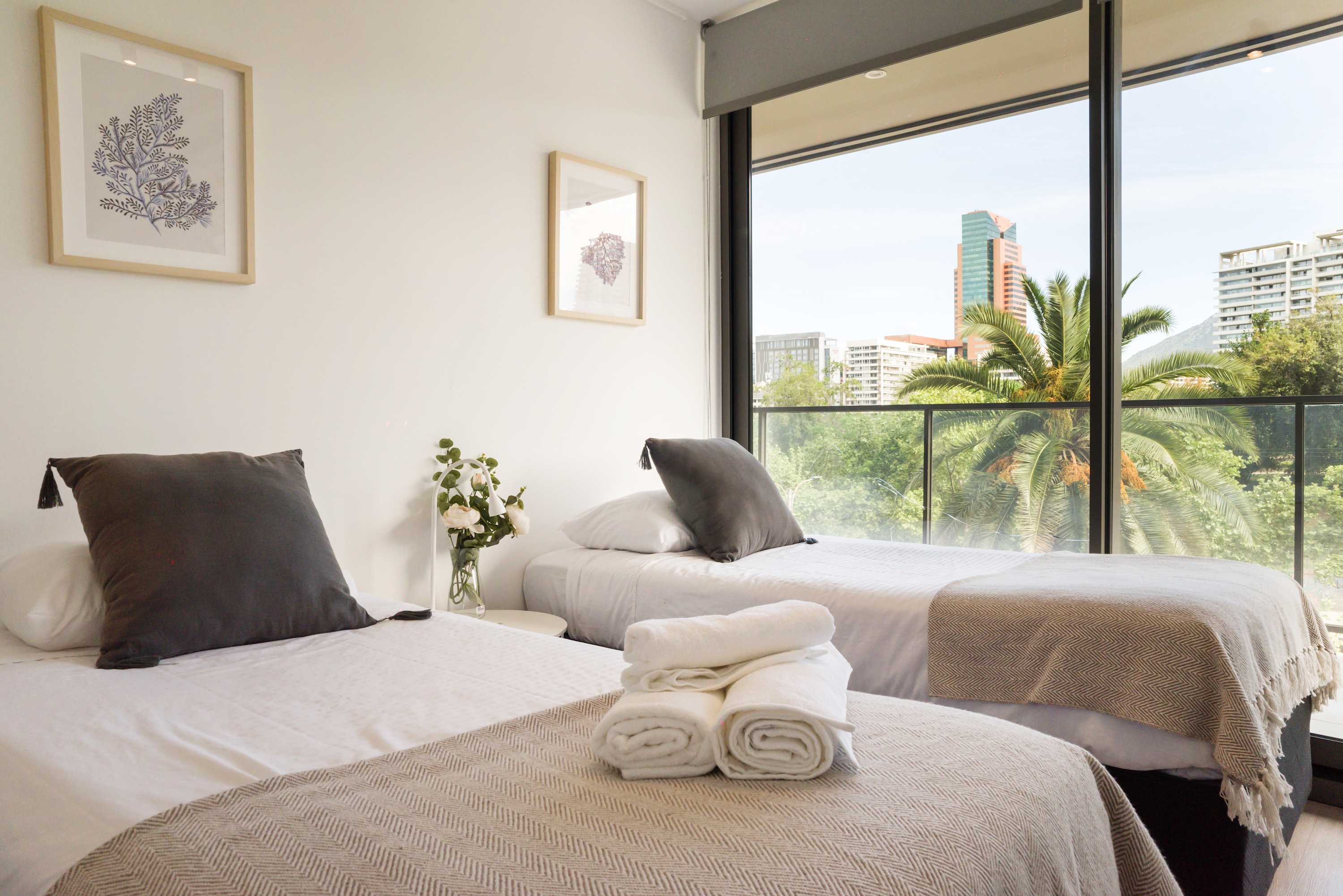 Enjoy breathtaking city views from this bright and cozy bedroom, perfect for relaxation and unwinding.