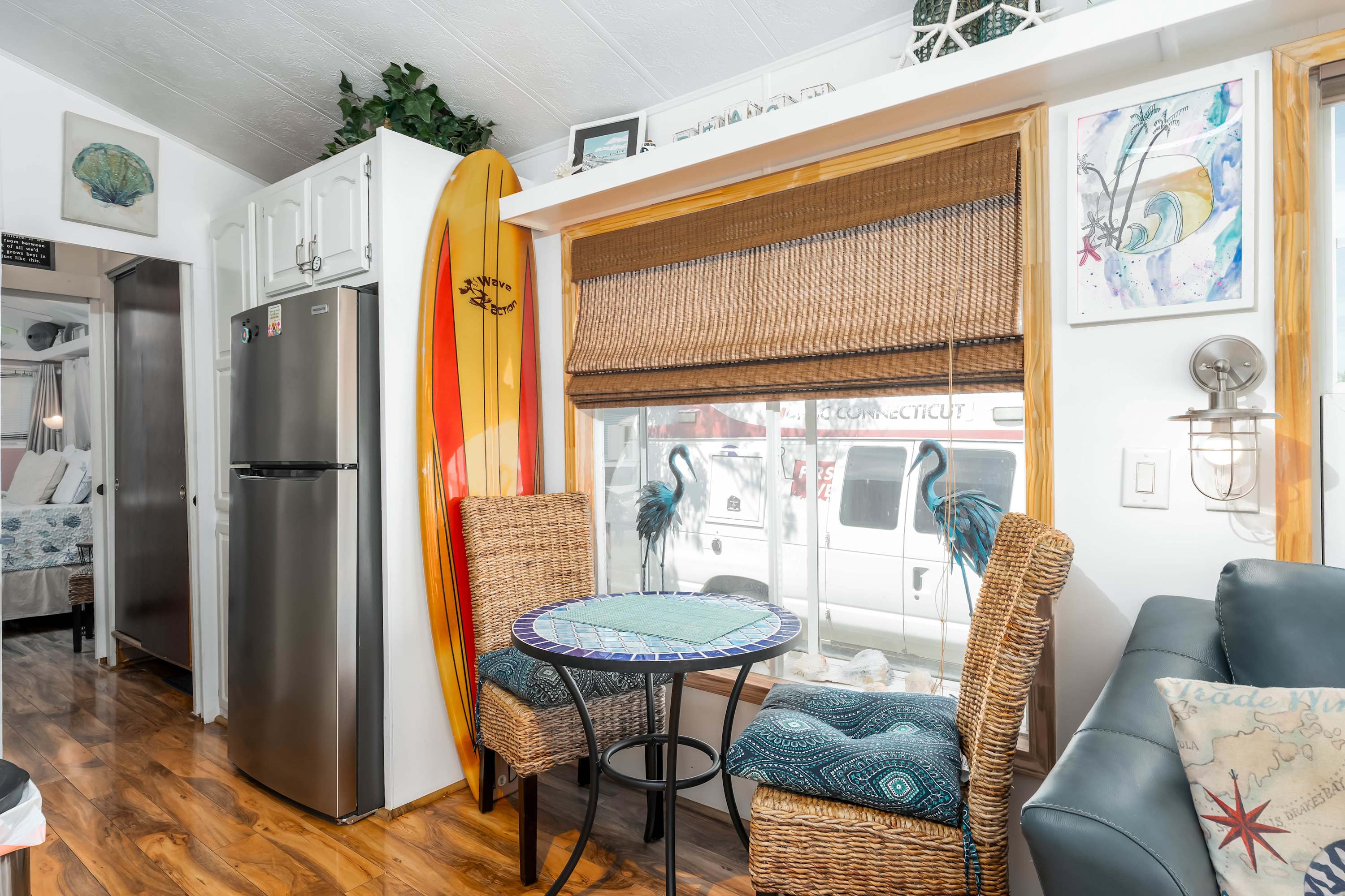 Bright Living Room – Relax in a sun-filled space with large windows, comfortable seating, and canal views.