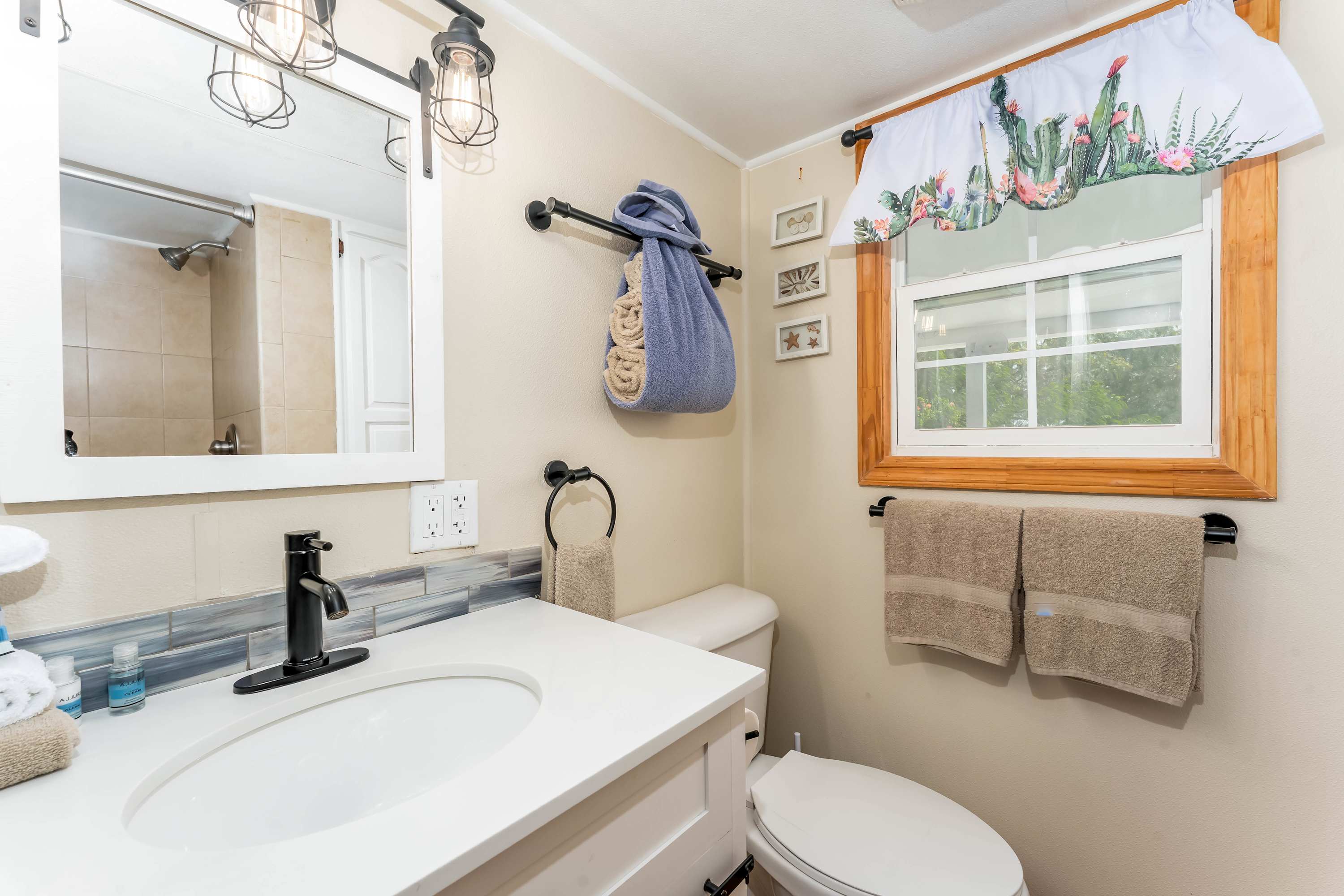 Bathroom – Complete with a vanity and a mirror,