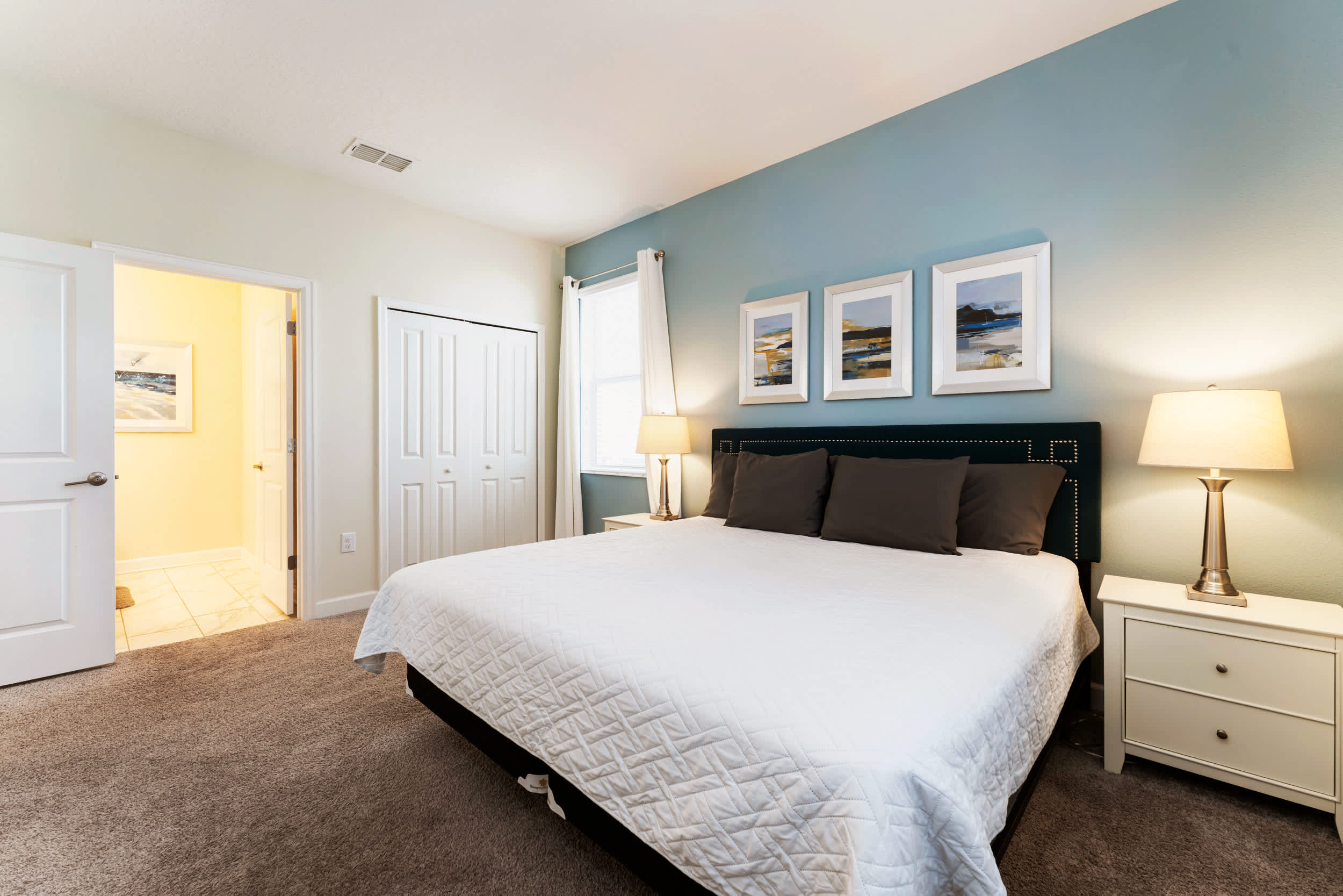 Relax in this spacious bedroom with a plush king-sized bed and soothing decor, perfect for unwinding after a day of adventure.