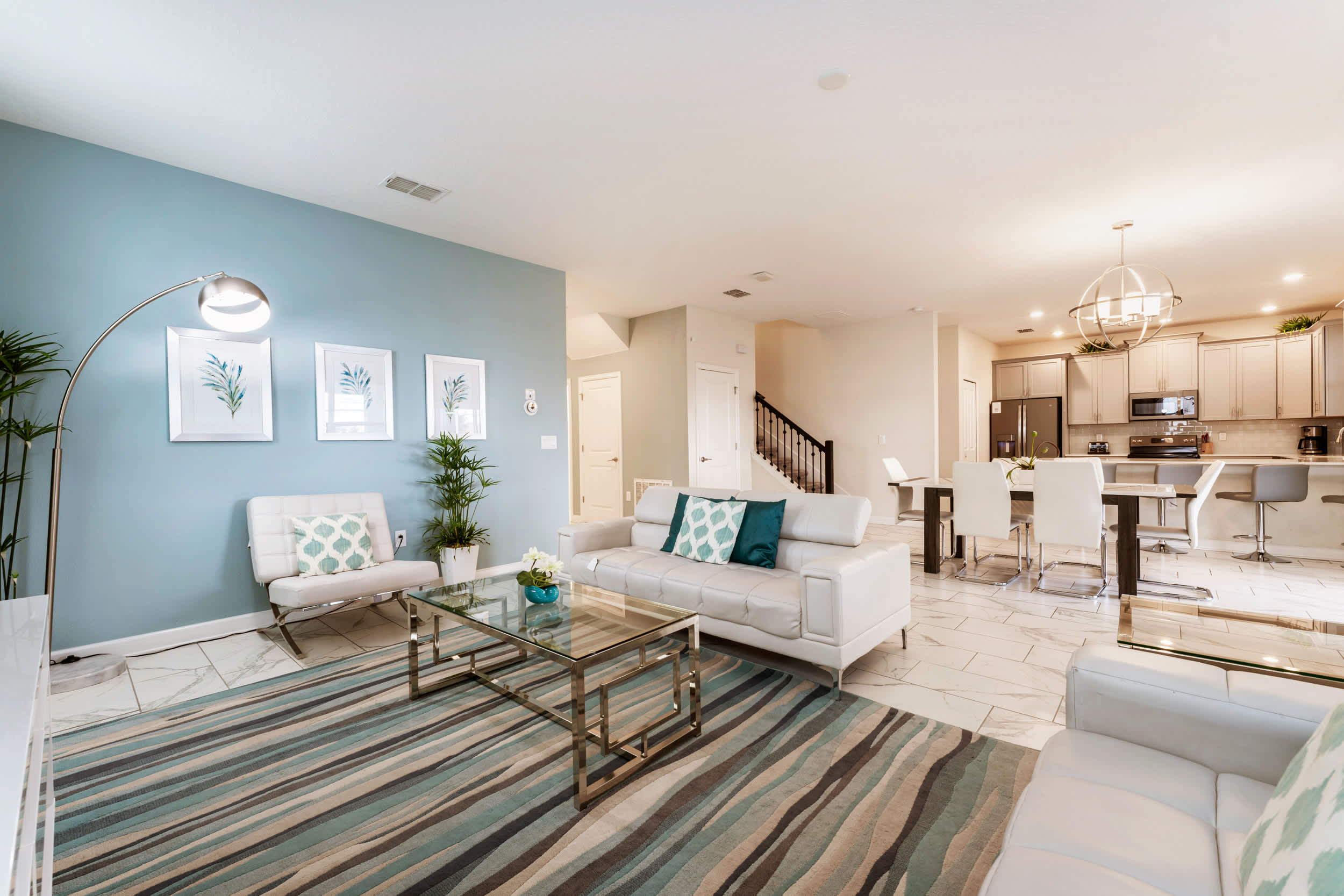 Experience luxury and comfort in this spacious, stylish living area with modern decor and open layout, perfect for relaxation and entertaining.