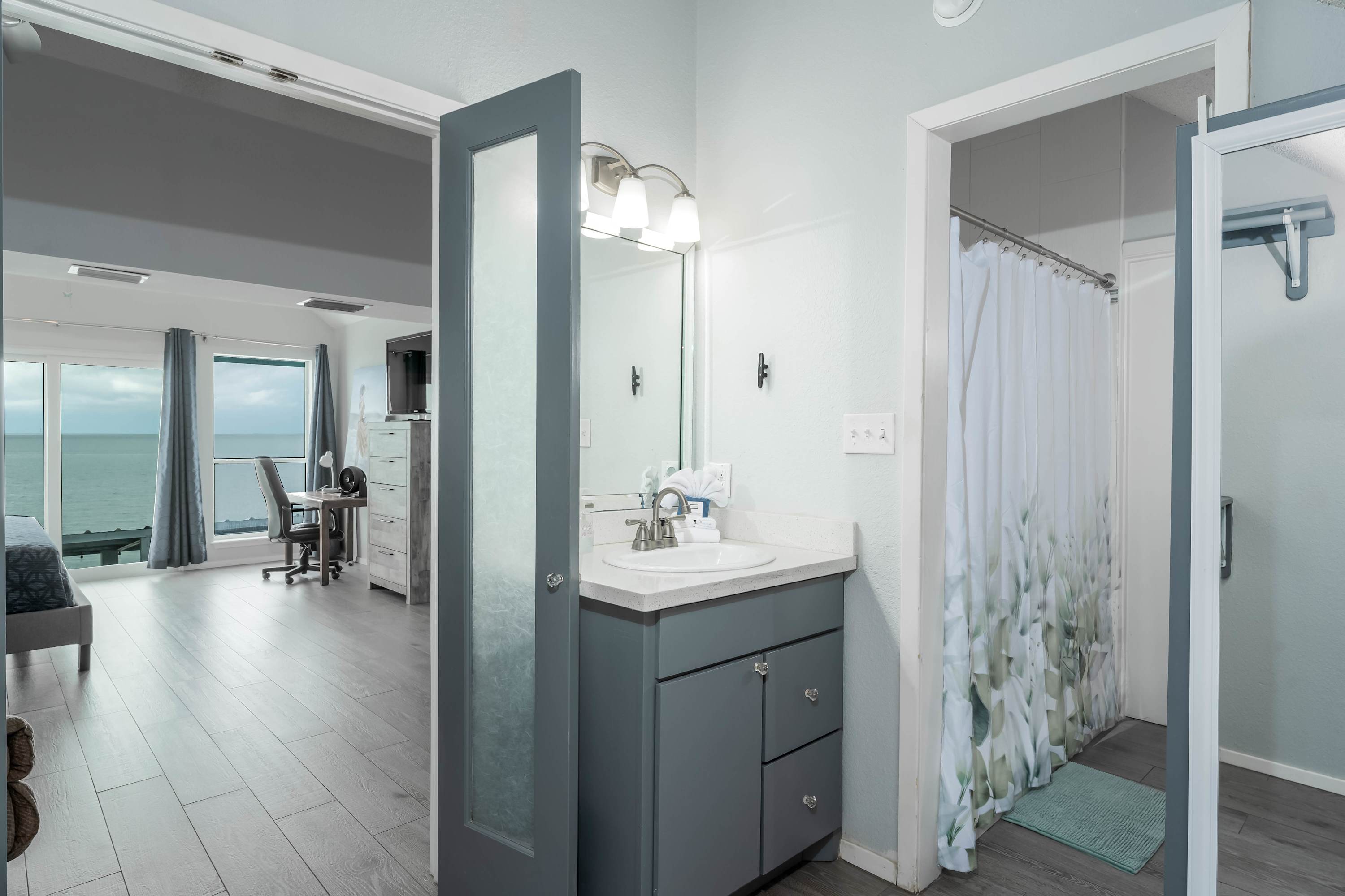 Primary Ensuite Bathroom — Modern ensuite with glass shower, vanity, and sleek finishes, located off the upstairs king suite.