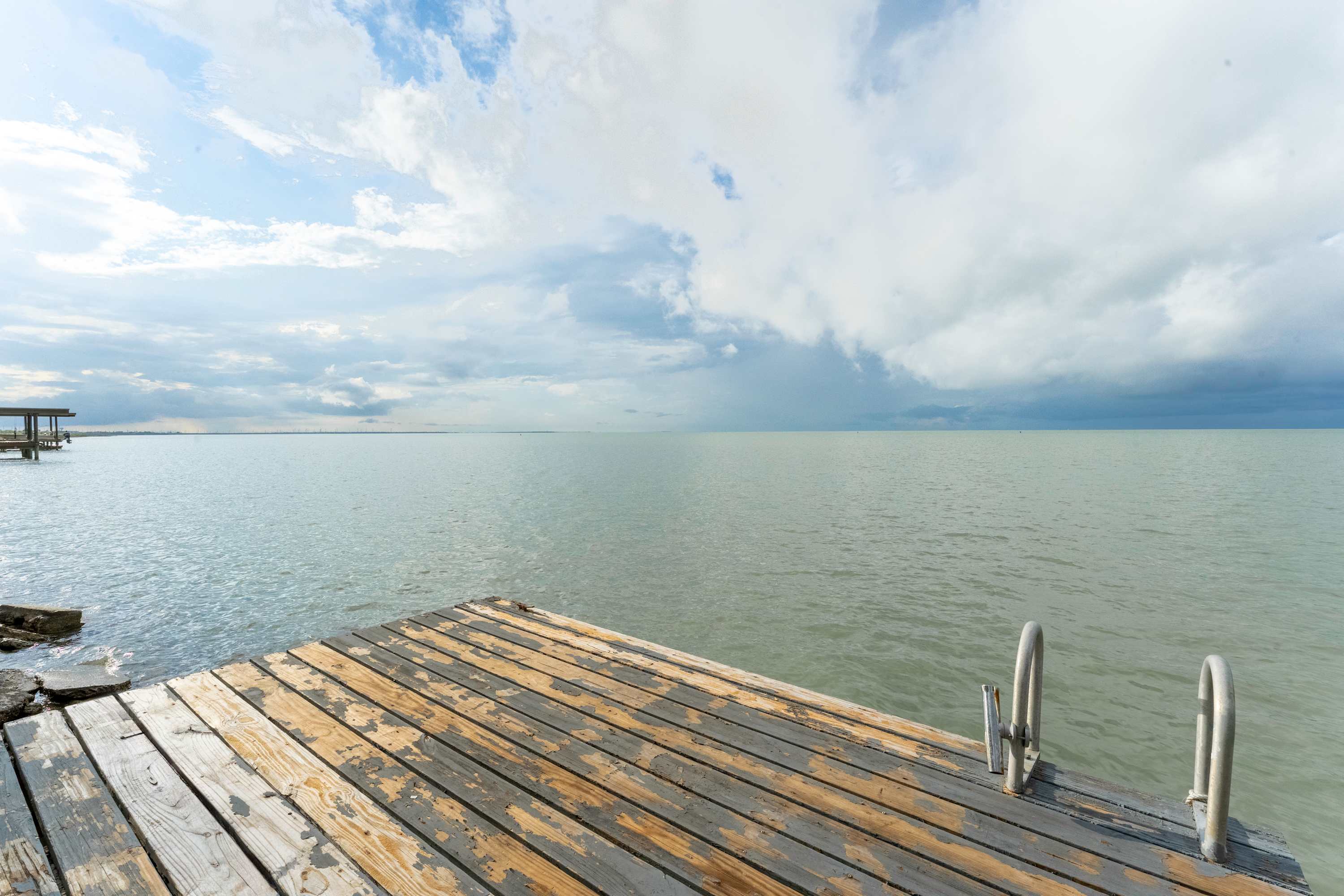 Dock Overlooking the Water — the perfect spot to watch the sunrise, cast a line, or unwind with a cup of coffee as boats drift by.