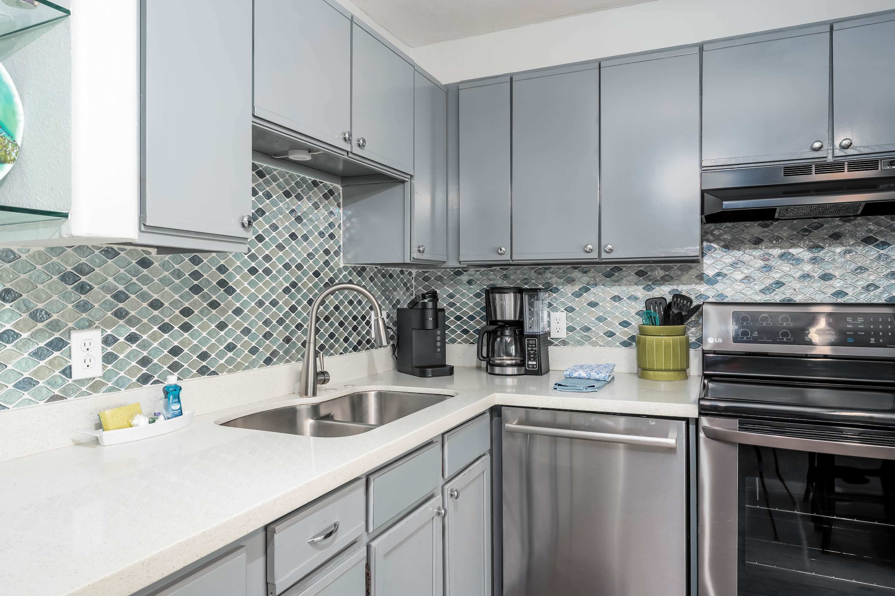 Fully Equipped Kitchen — Stainless-steel appliances, coffee maker, and all the essentials to make home-cooked meals easy.