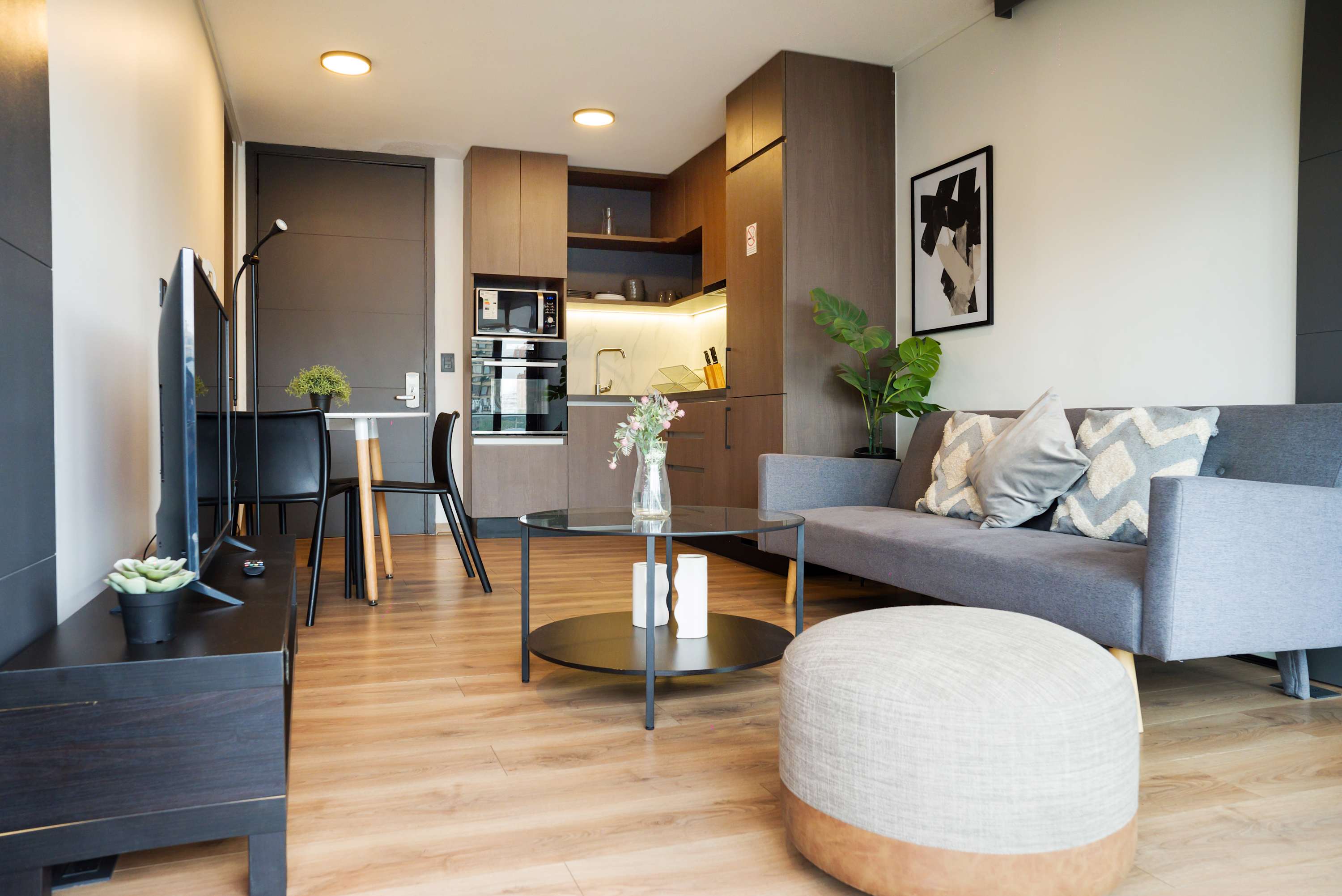 Cozy living area with modern amenities and stylish decor, perfect for relaxation and entertainment.