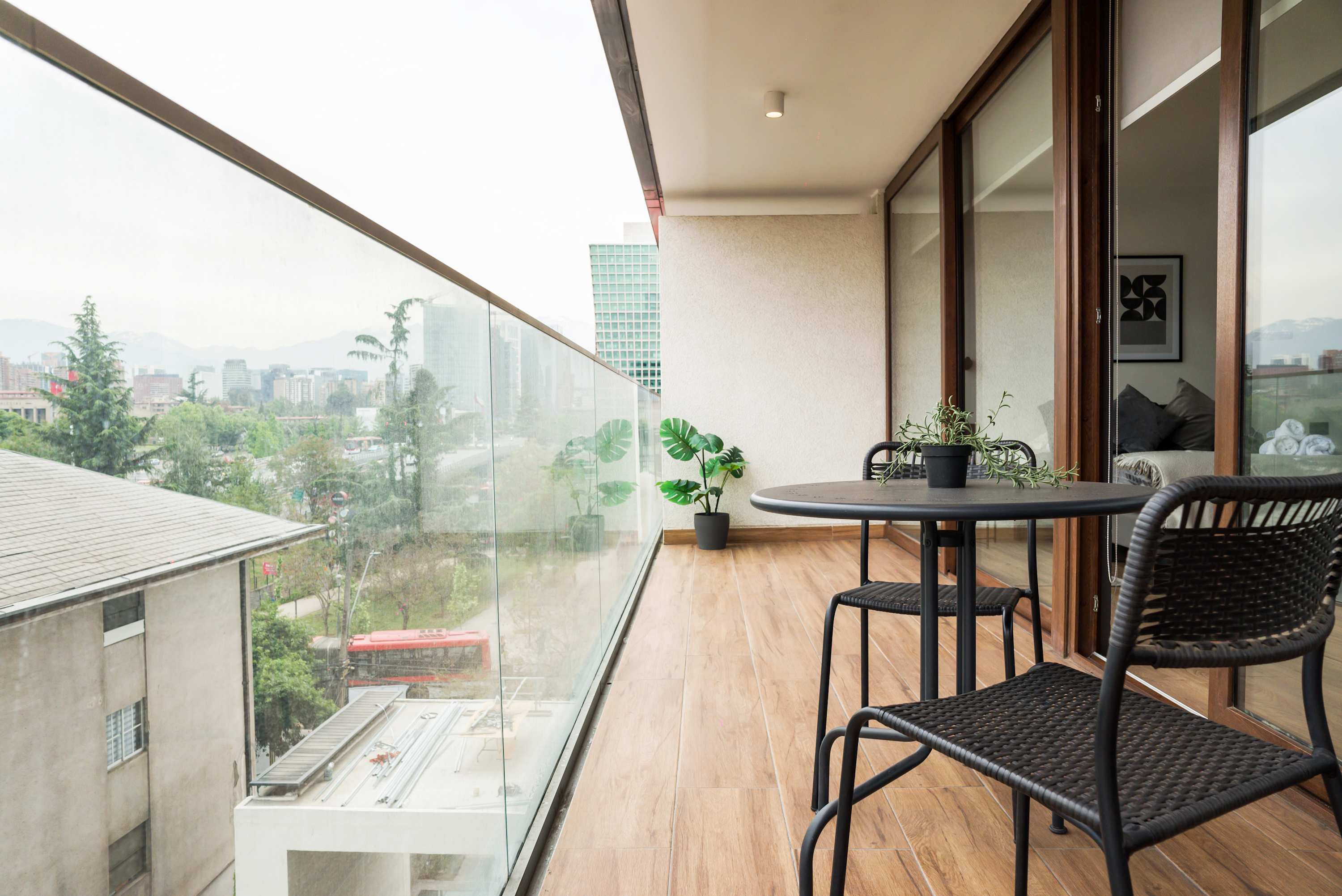 Enjoy stunning city views from this modern balcony, perfect for relaxing with a morning coffee or evening drink.