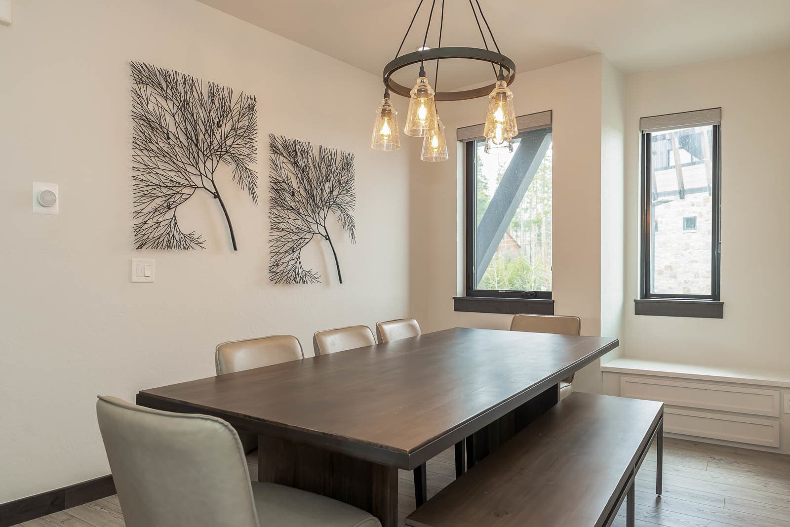 Dining Area: Gather around the stylish table with stunning views and unique art for memorable meals!