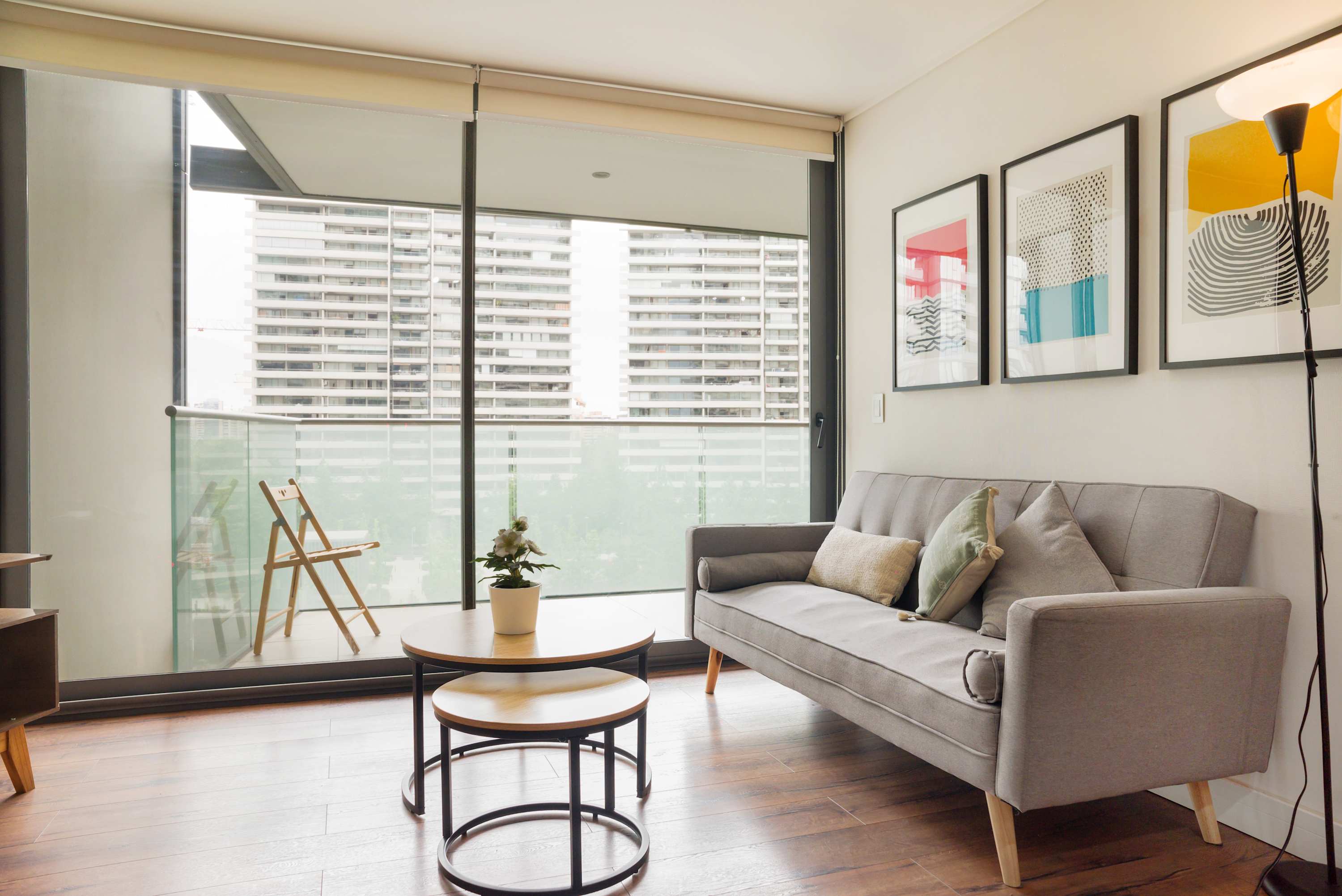 Modern living area with city views and balcony access, perfect for relaxation.