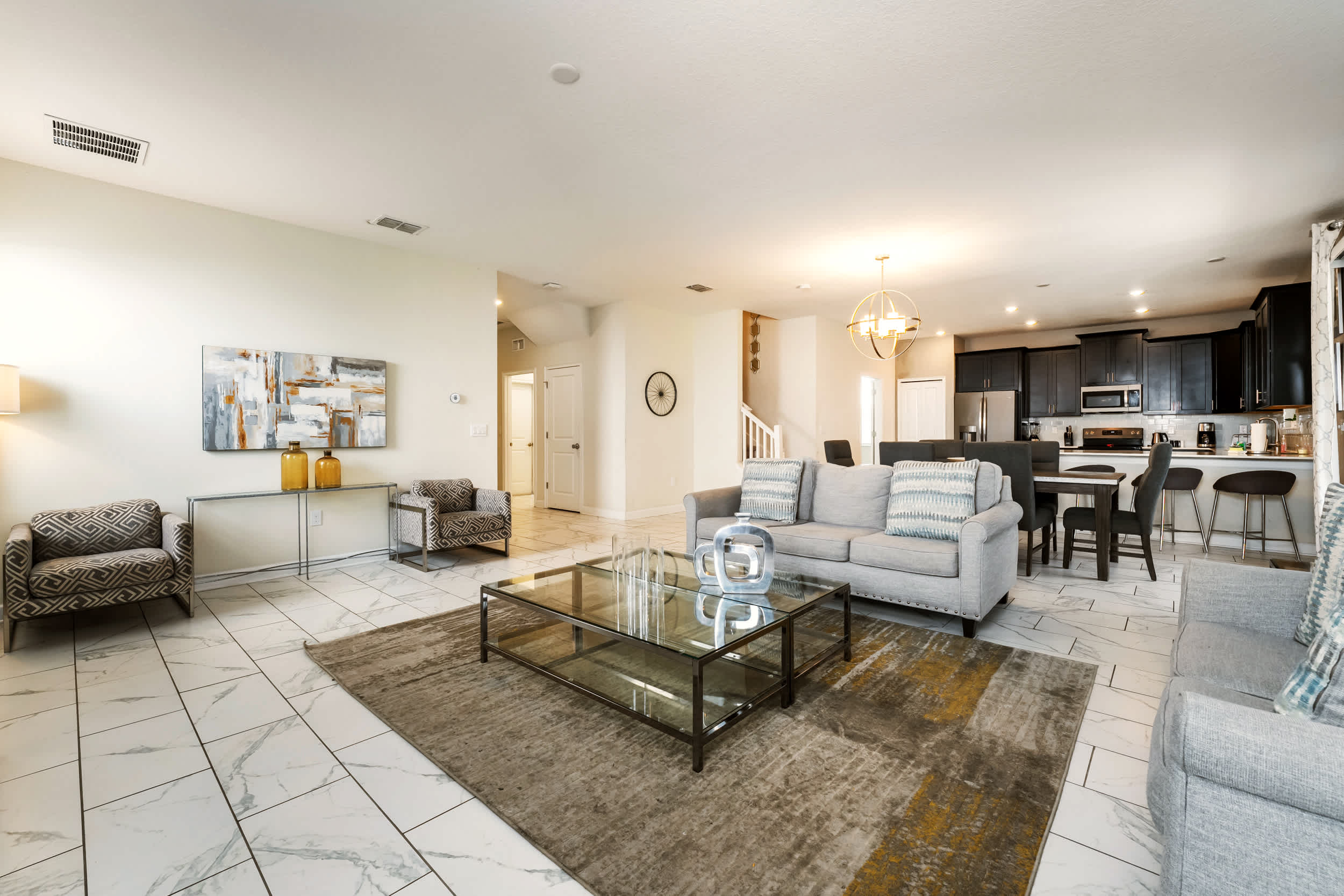 Experience luxury and comfort in this spacious living area with modern decor and an open layout perfect for gatherings.