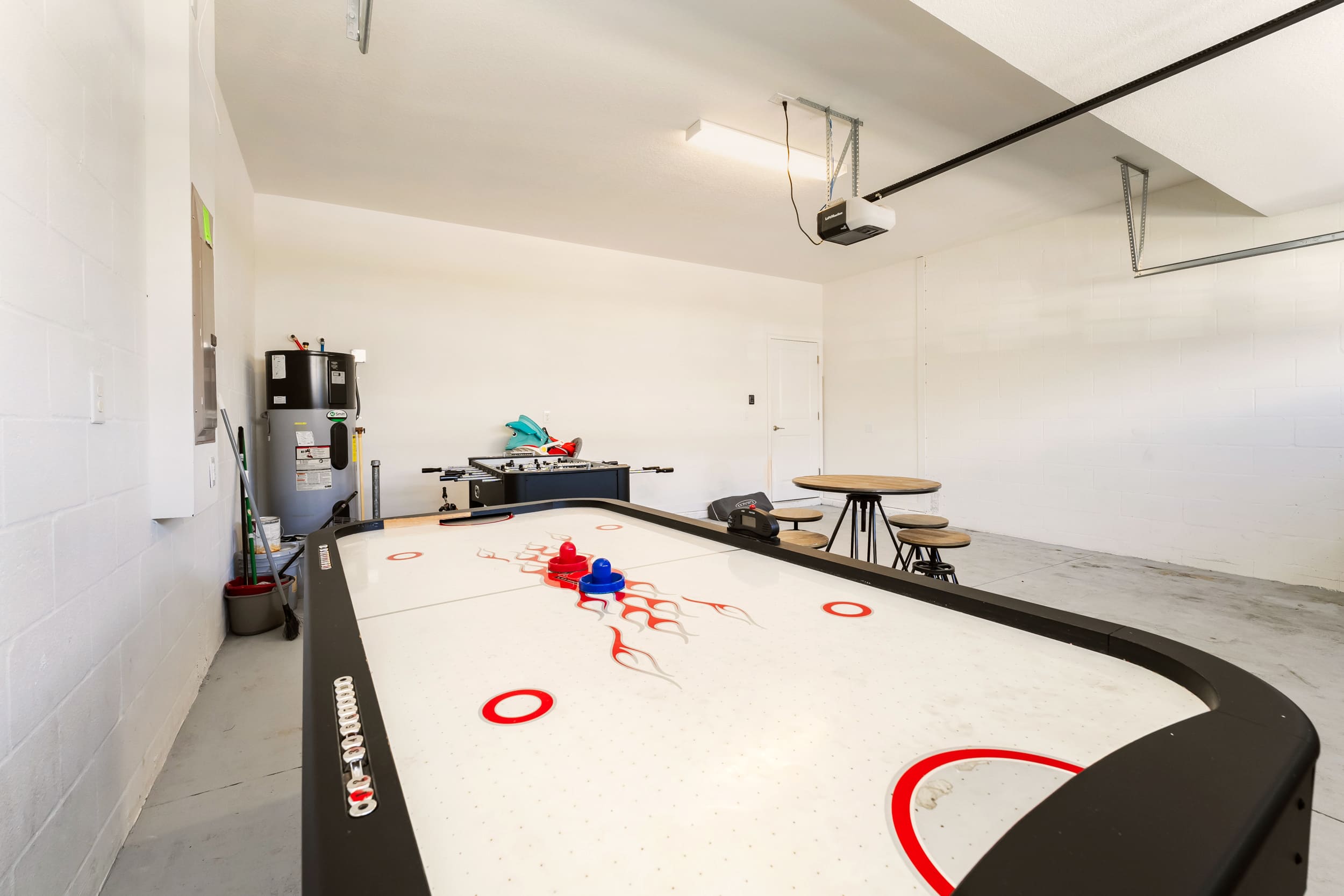 Enjoy fun-filled game nights in this spacious game room featuring air hockey and foosball tables.