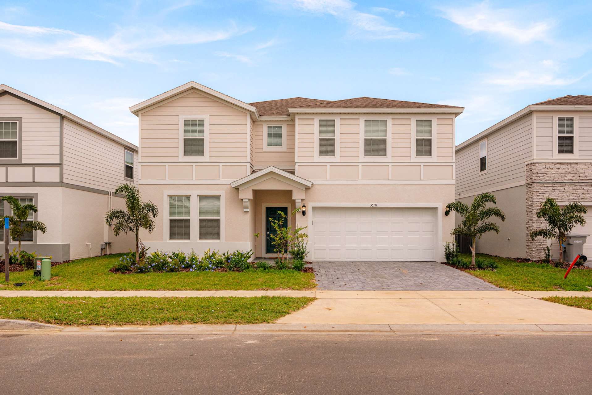 Spacious villa with modern design and lush landscaping, perfect for large groups seeking comfort and style.