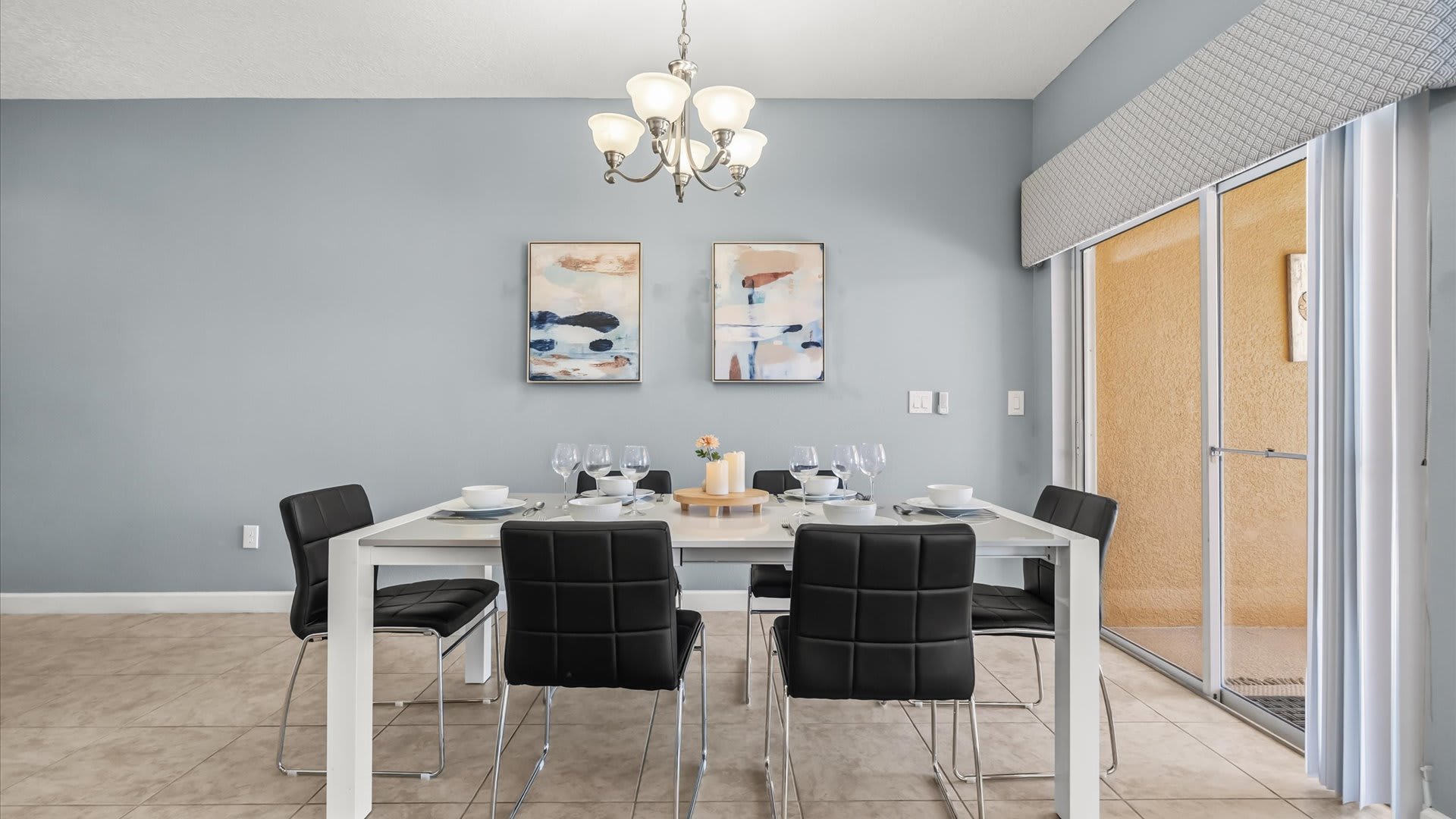 Dining Space: Gather for meals at the dining table with pool views and open flow to the kitchen.