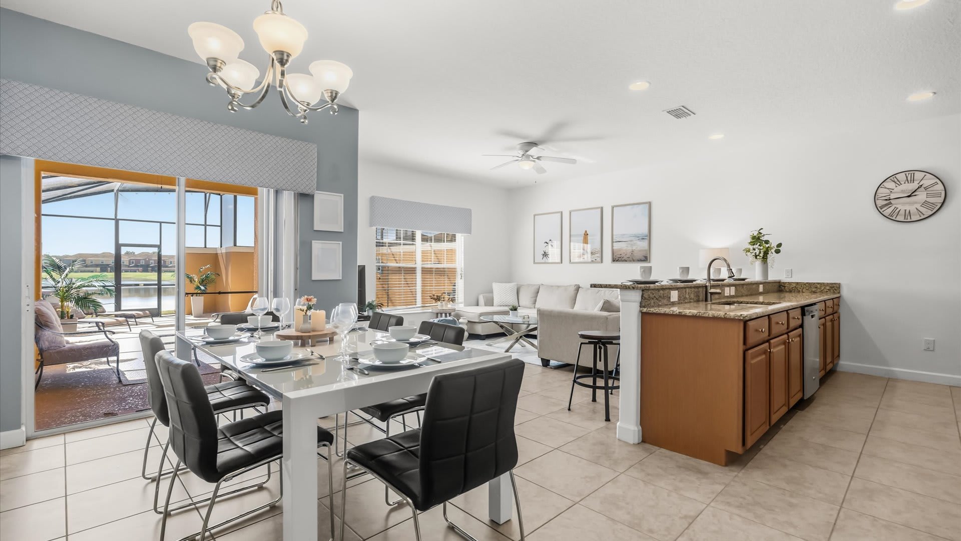 Dining Space: Gather for meals at the dining table with pool views and open flow to the kitchen.
